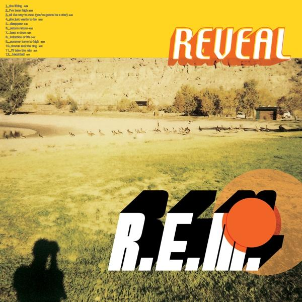 Album borító "R.E.M." zenekar névvel és "Reveal" album címmel egy tájon.