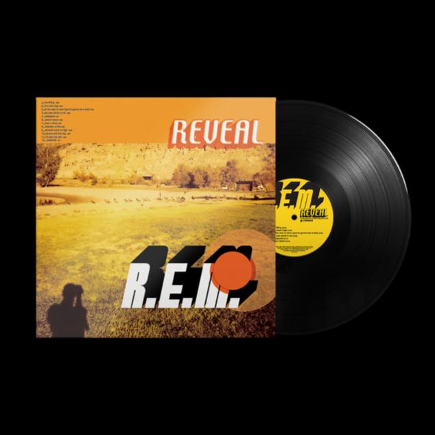 R.E.M. Reveal album borítója és bakelit lemez. A borító narancssárga, tájképpel és szöveggel.