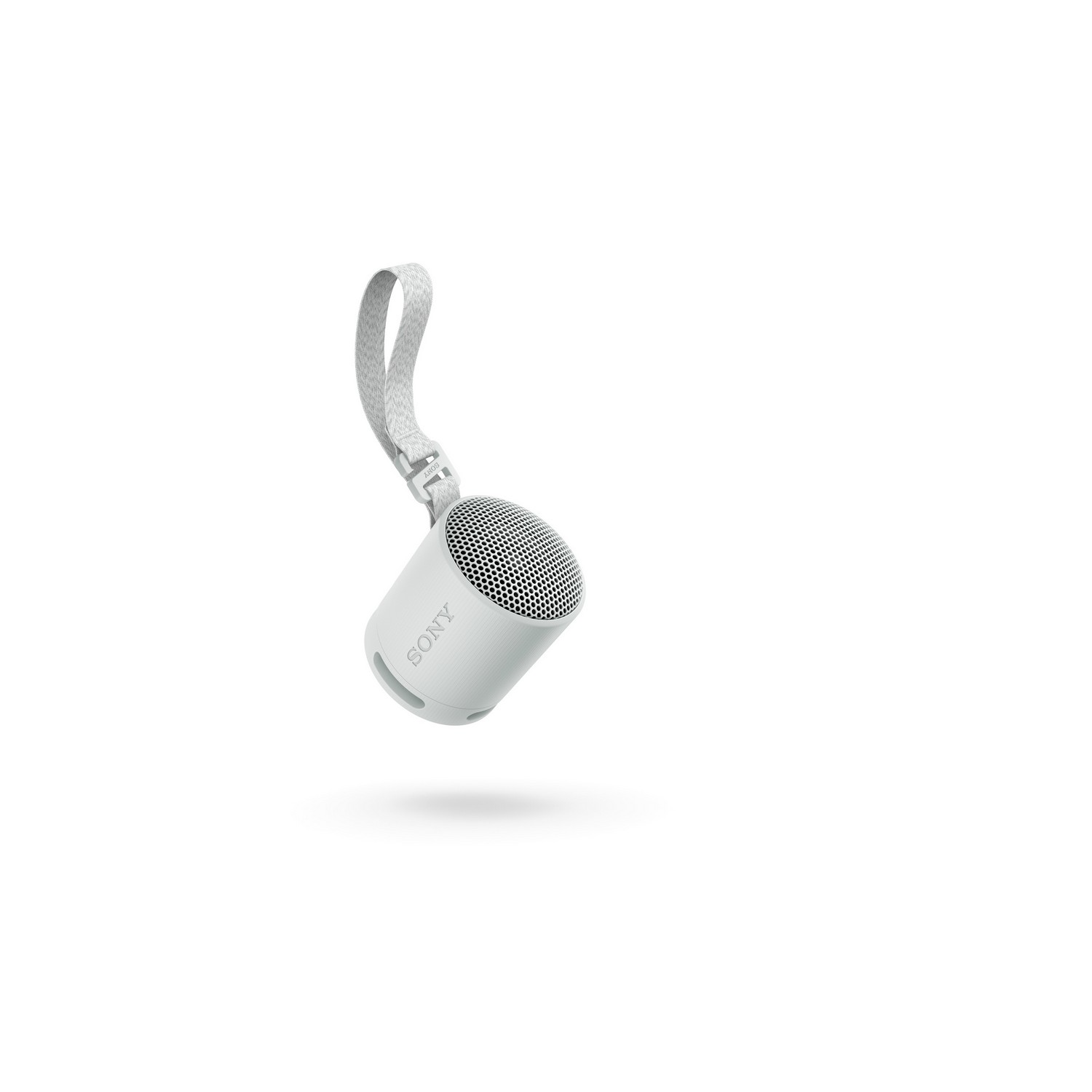 Petite enceinte blanche avec une sangle de transport, isolée sur fond blanc.