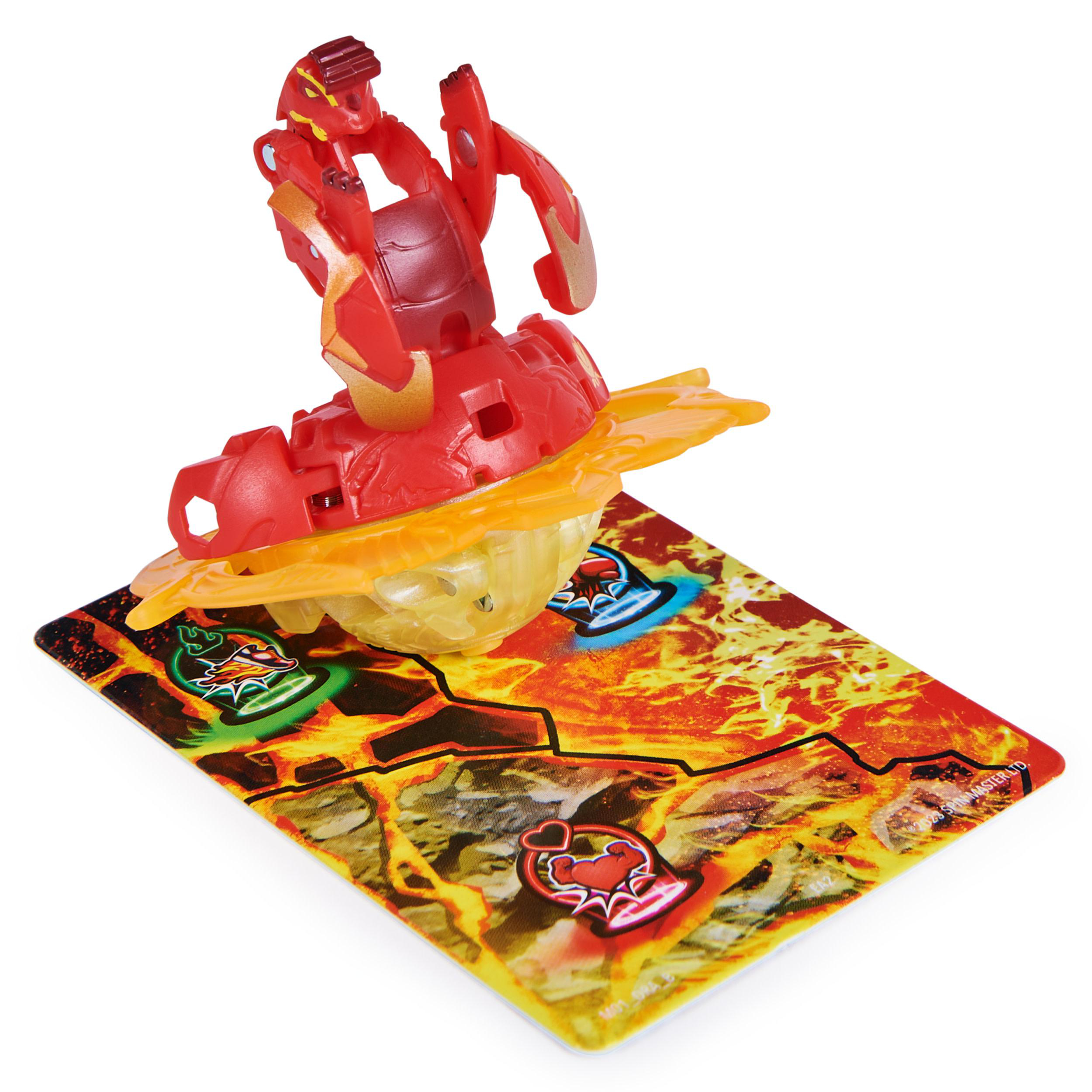 Ein rotes und gelbes Bakugan-Spielzeug auf einer Spielkarte mit Lava-Thema und mehreren Symbolen.