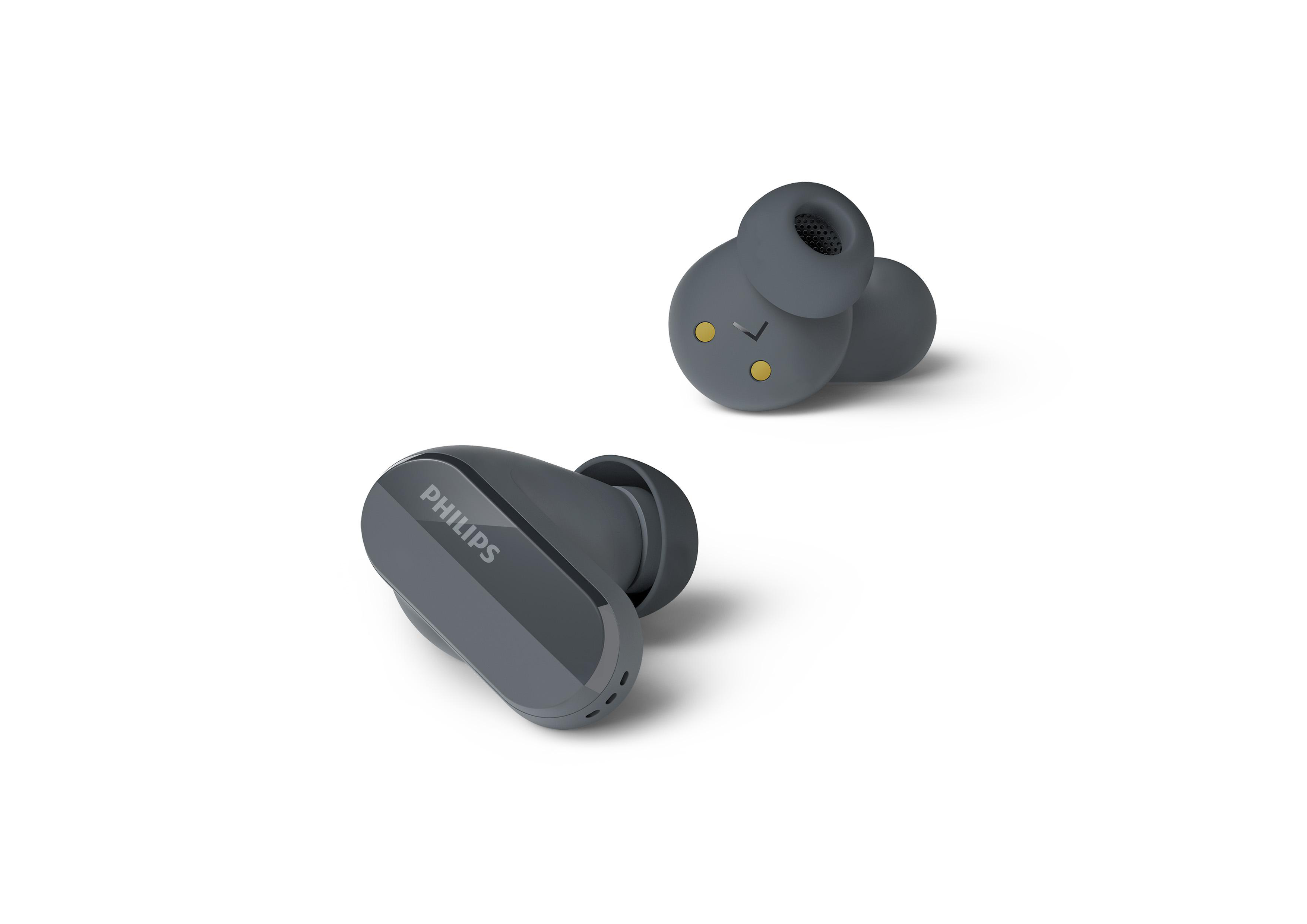 Graue Philips Ohrhörer auf Weiß. Einer ist im Fokus. Modernes Design und saubere Ästhetik.