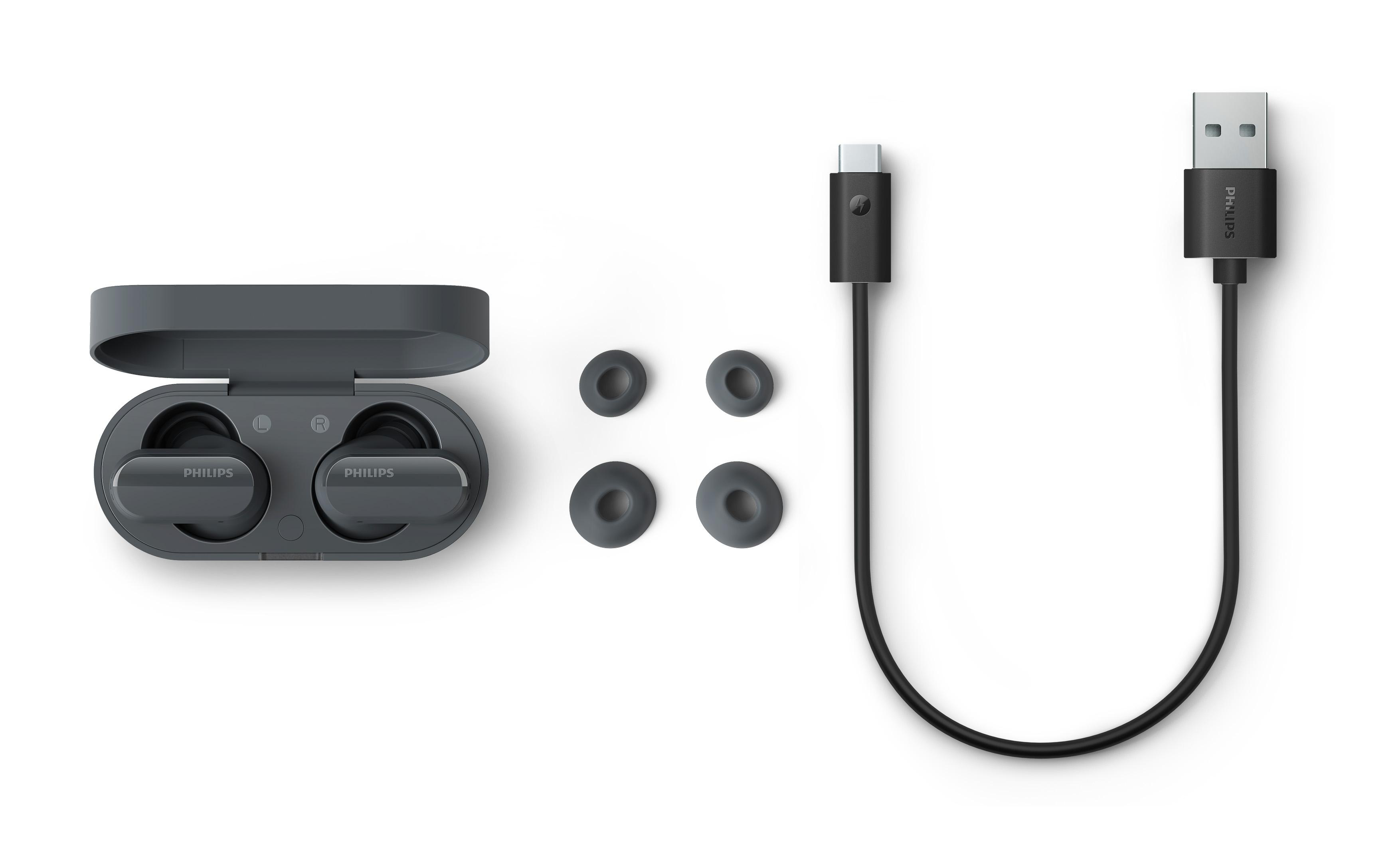Kabellose Ohrhörer, Ladecase und USB-Kabel sowie zusätzliche Ohrstöpsel.