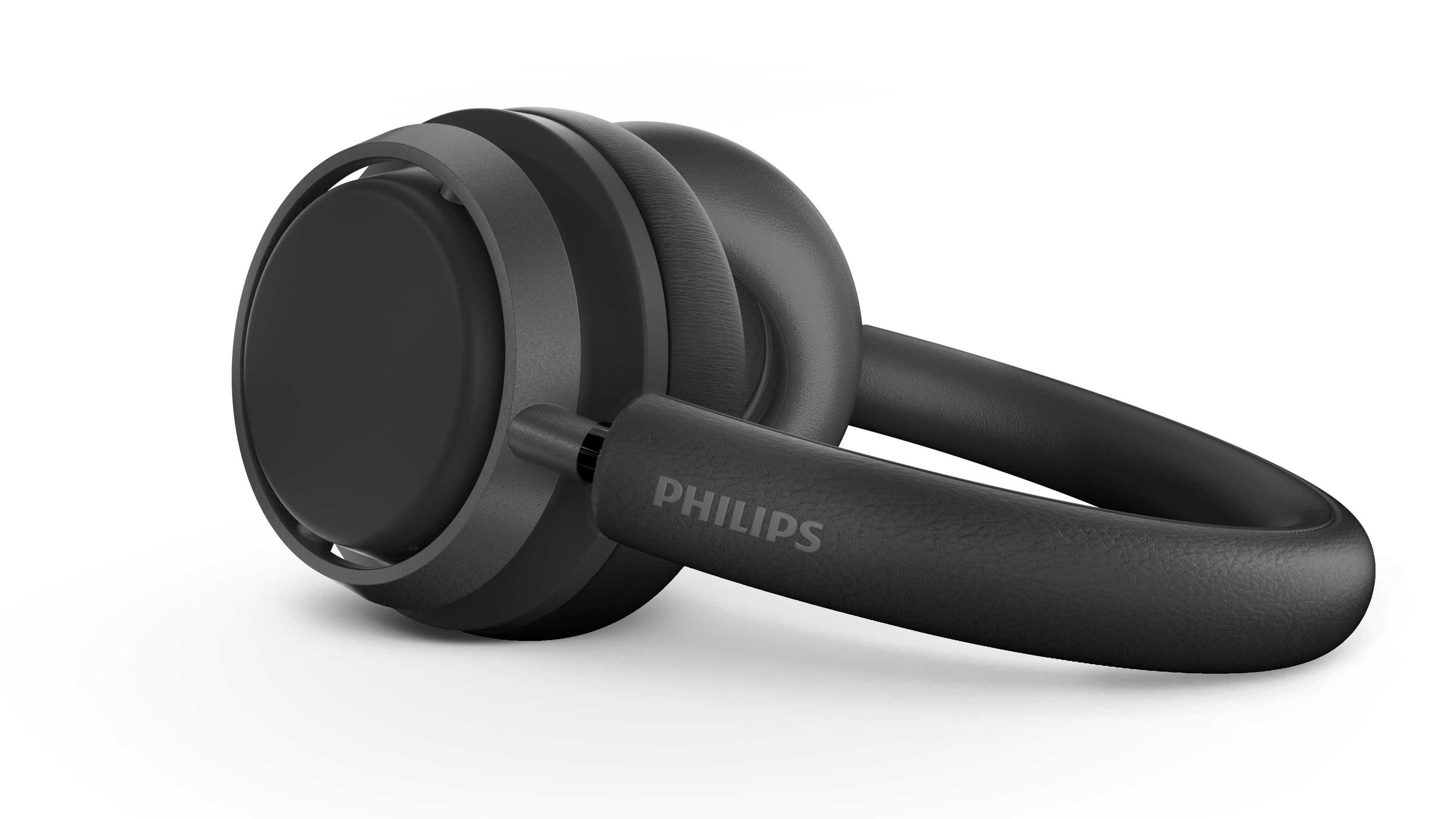 Schwarze Philips-Kopfhörer, die auf weißer Oberfläche liegen. Die Kopfhörer haben ein schlankes, modernes Design.