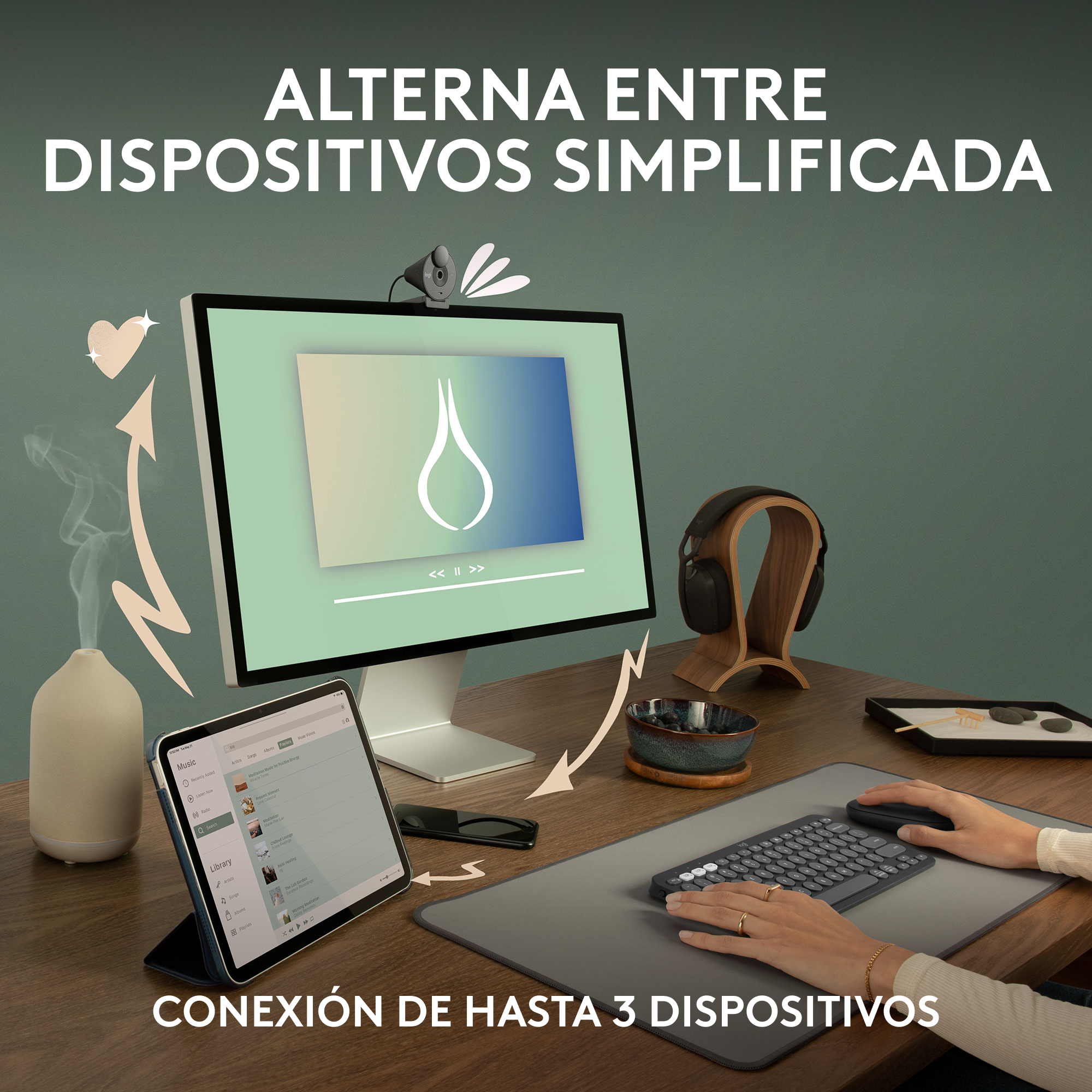 Espacio de trabajo con monitor, tableta, teclado, ratón y un difusor.