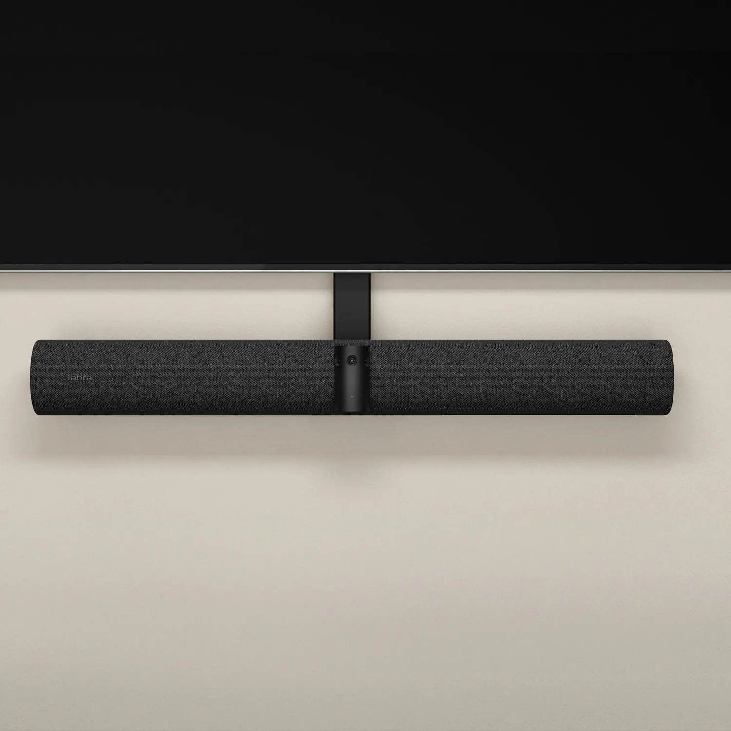 Eine lange, schwarze Soundbar unter einem schwarzen Fernseher montiert. Die Wand ist hellbeige.