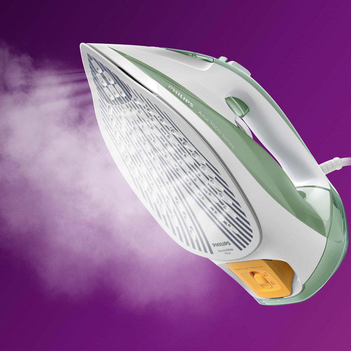 Biało-zielone żelazko Philips, wydobywająca się para. Jest na fioletowej powierzchni, widok z góry.