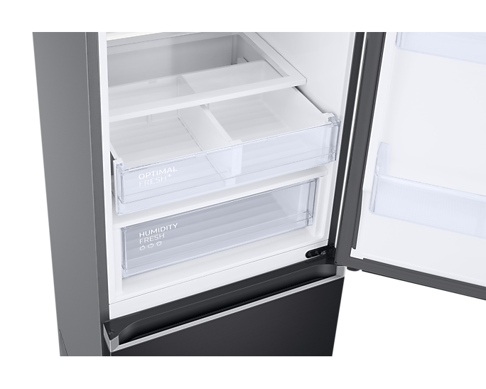 Réfrigérateur ouvert avec tiroirs transparents étiquetés 'Optimal Fresh' et 'Humidity'.