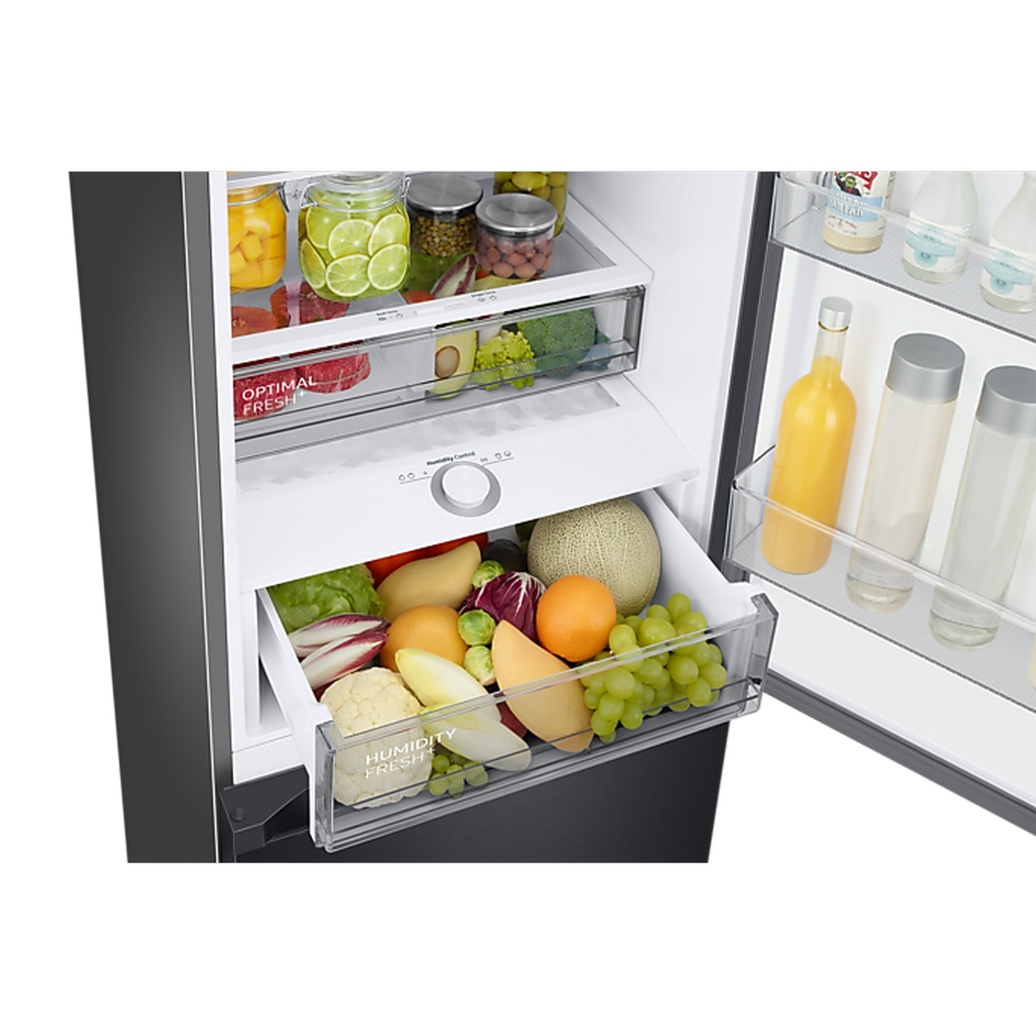 A refrigerator drawer filled with fresh produce, including fruits and vegetables. There is a control knob.