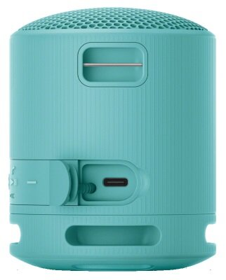 Mały, turkusowy głośnik przenośny. Posiada porty i przyciski.