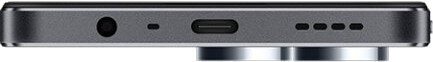 Zbliżenie na dół telefonu, pokazujące gniazdo słuchawkowe, port USB-C i otwory.