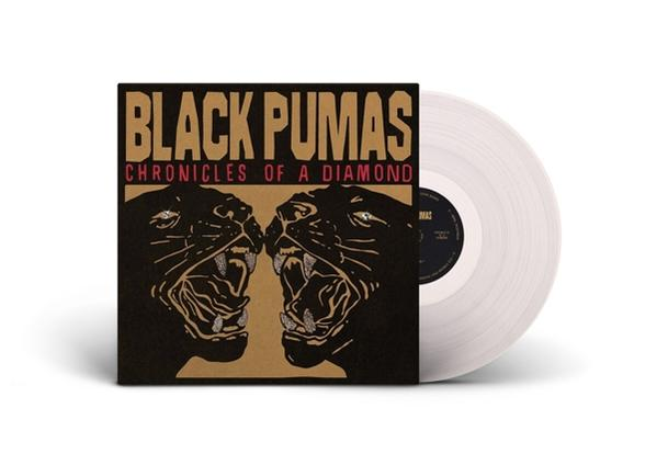 Albumcover: Black Pumas, Text in Gold, Pantherköpfe. Weiße Vinyl-Schallplatte. Braun-Schwarz-Farbschema.