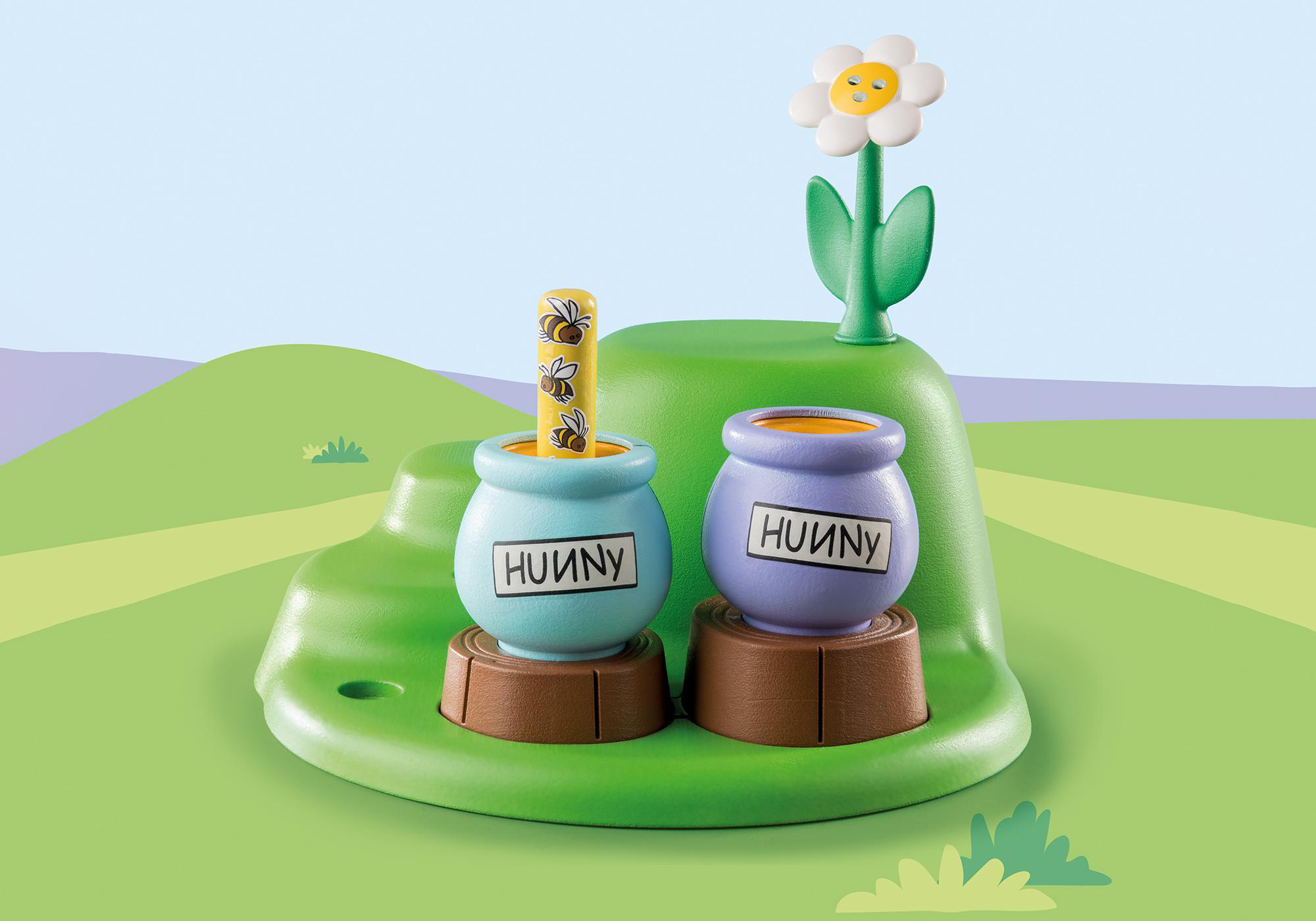 Winnie-the-Pooh-Szene: zwei Honigtöpfe mit Bienen und einer Blume auf einem grünen Hügel.