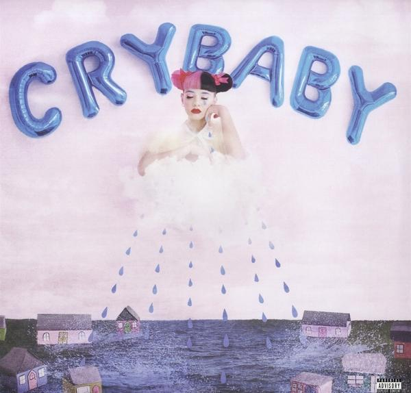 Albumcover mit einer Frau auf einer Wolke mit 'CRYBABY' in blauen Ballons und Häusern darunter.