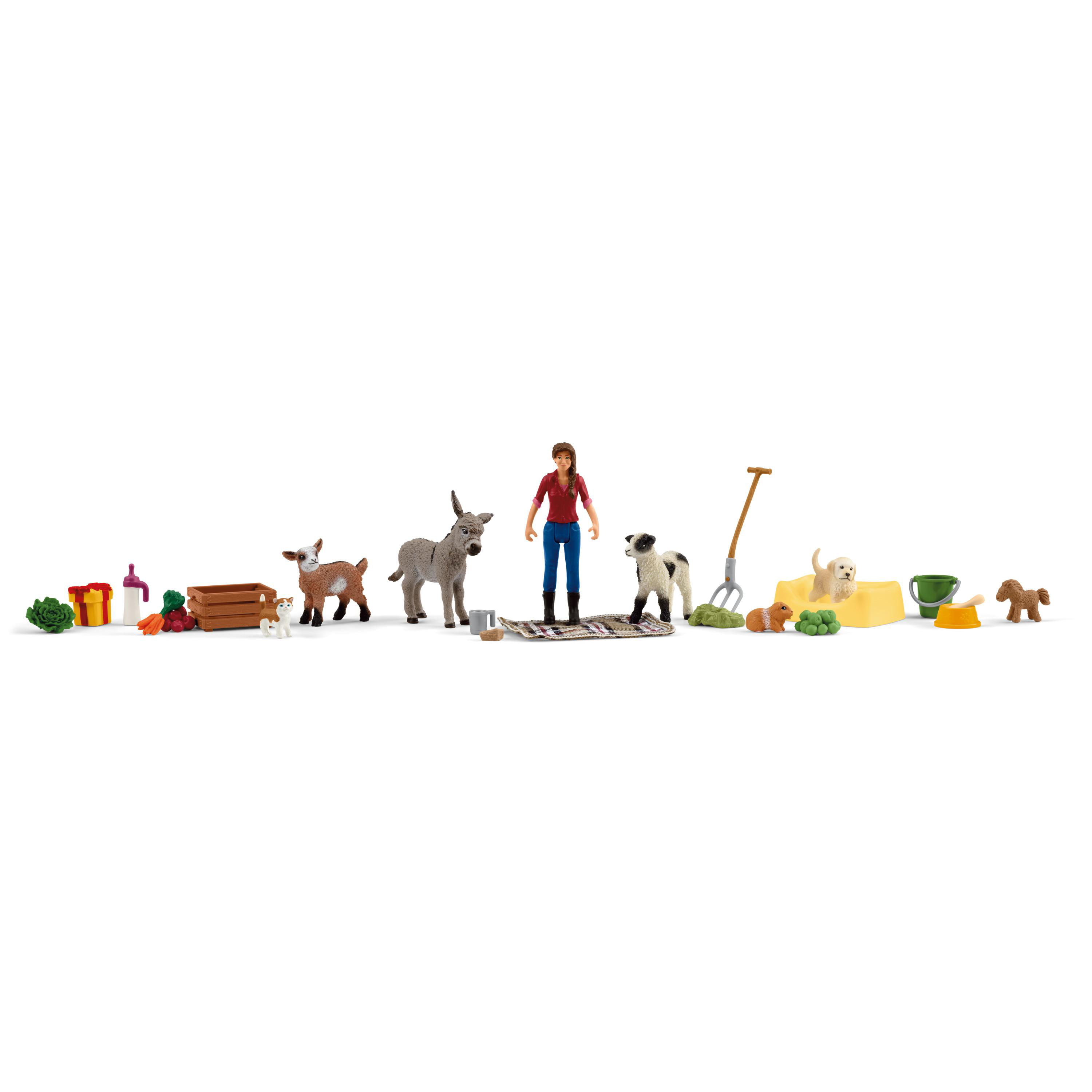 Bauernhoftierspielzeug und eine Person, darunter eine Ziege, ein Esel, ein Hund und Werkzeuge.