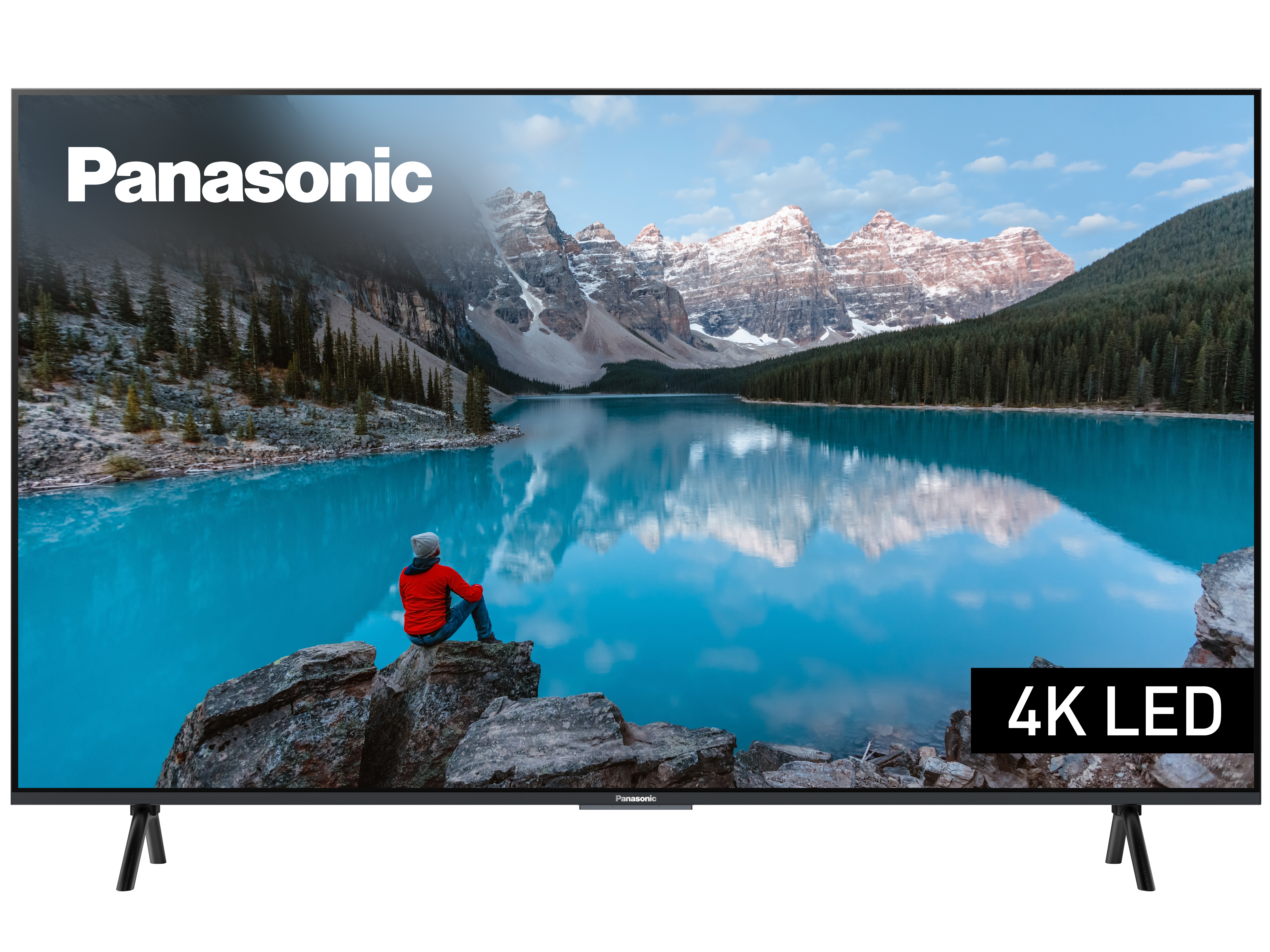 Ein Panasonic-Fernseher zeigt eine malerische Ansicht eines Sees und Berge mit einer Person auf einem Felsen.