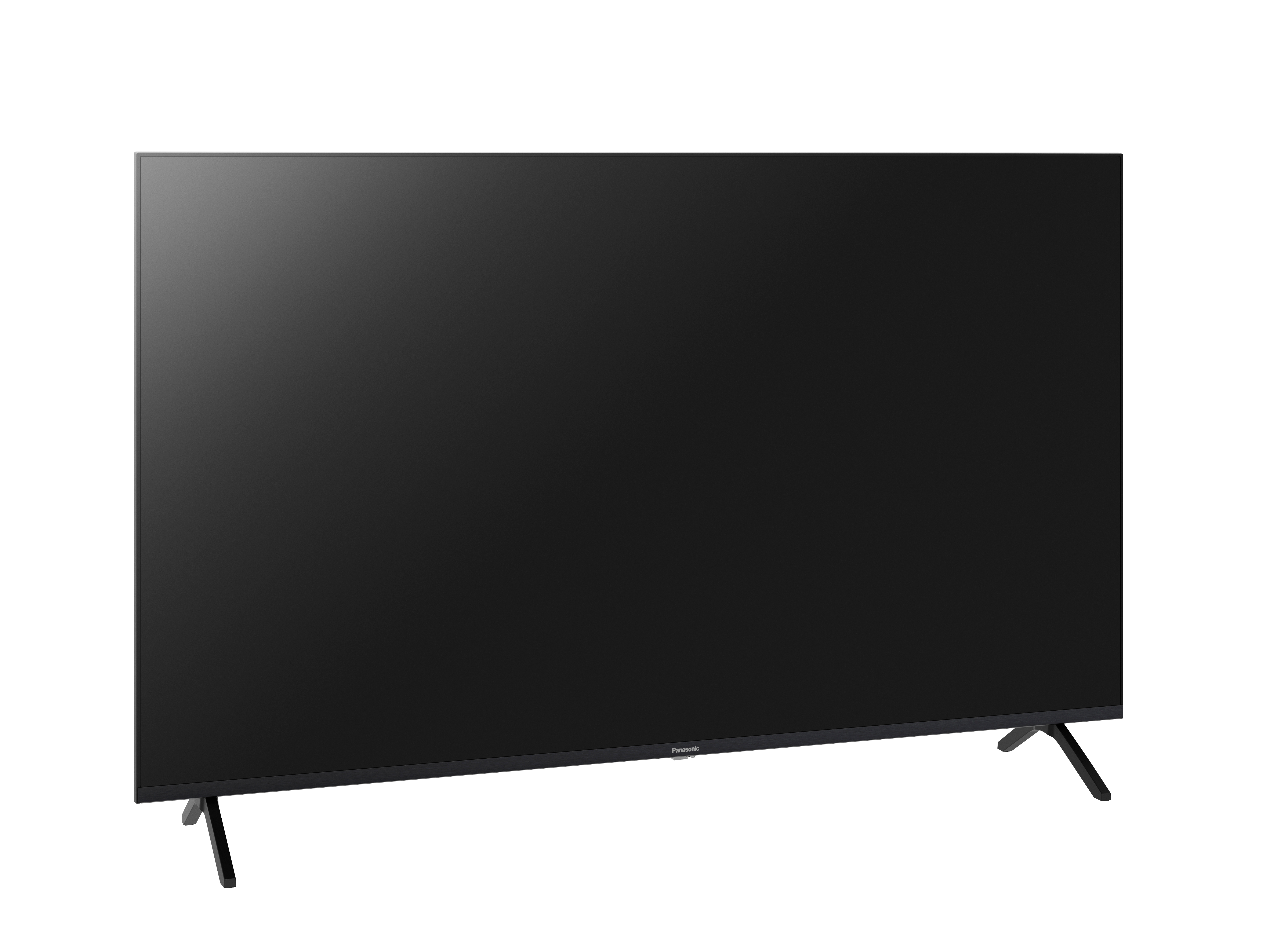 Ein schwarzer Fernseher mit dunklem Bildschirm und dünnen Beinen steht vor weißem Hintergrund.