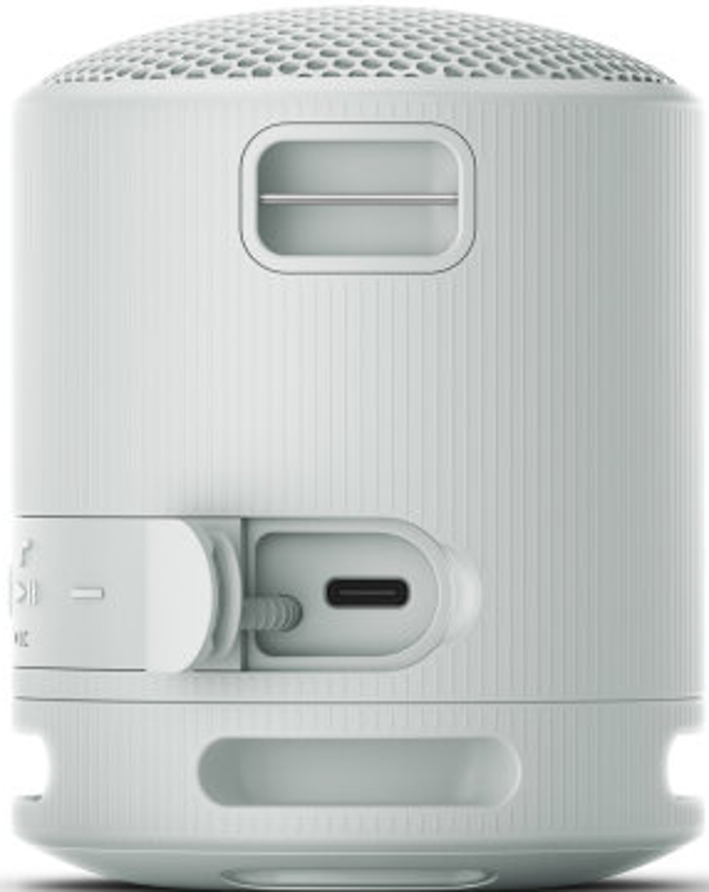 Un petit haut-parleur portable blanc avec port USB-C et boutons de commande.