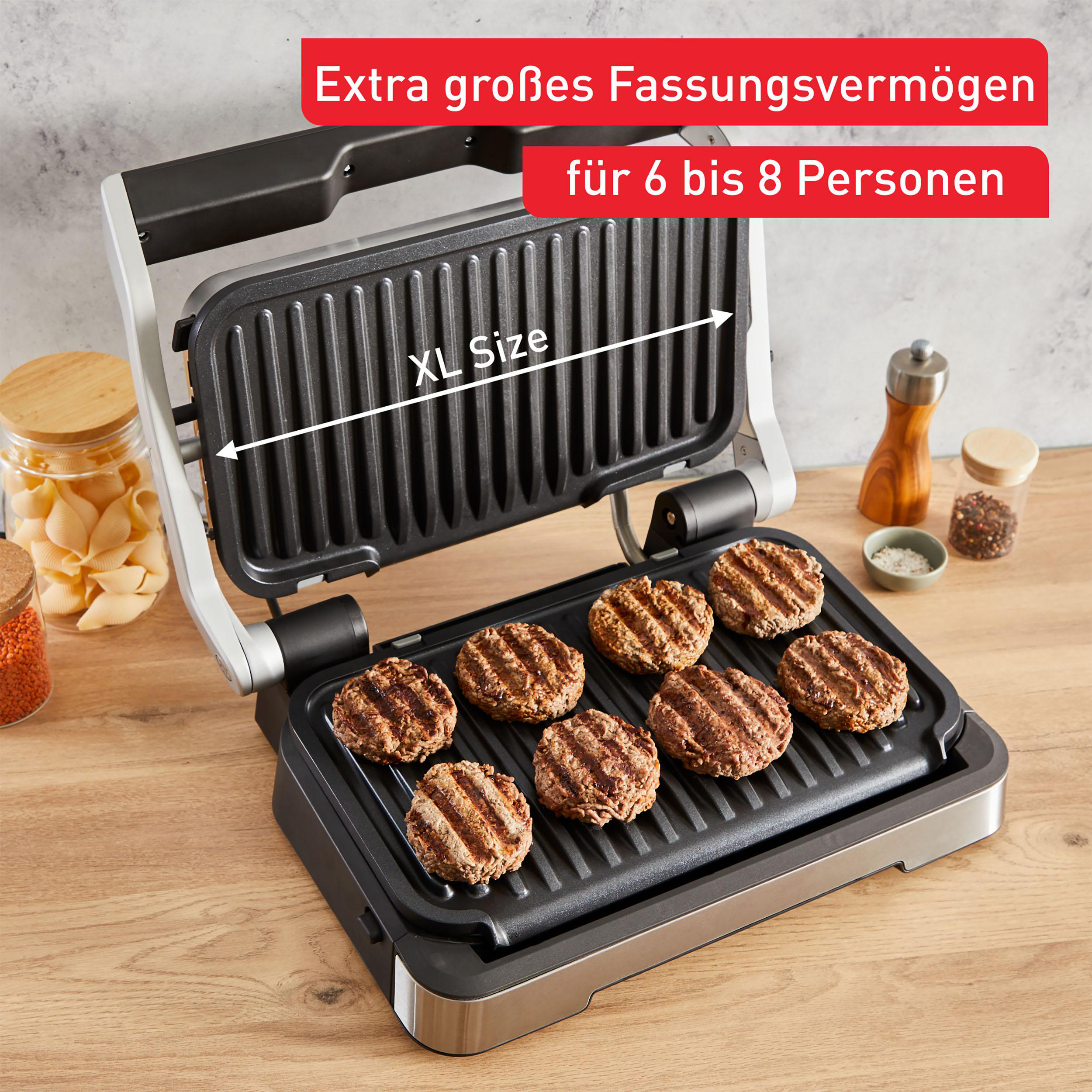 XL-Grill mit Burgern. Text: Extra großes Fassungsvermögen für 6-8 Personen.