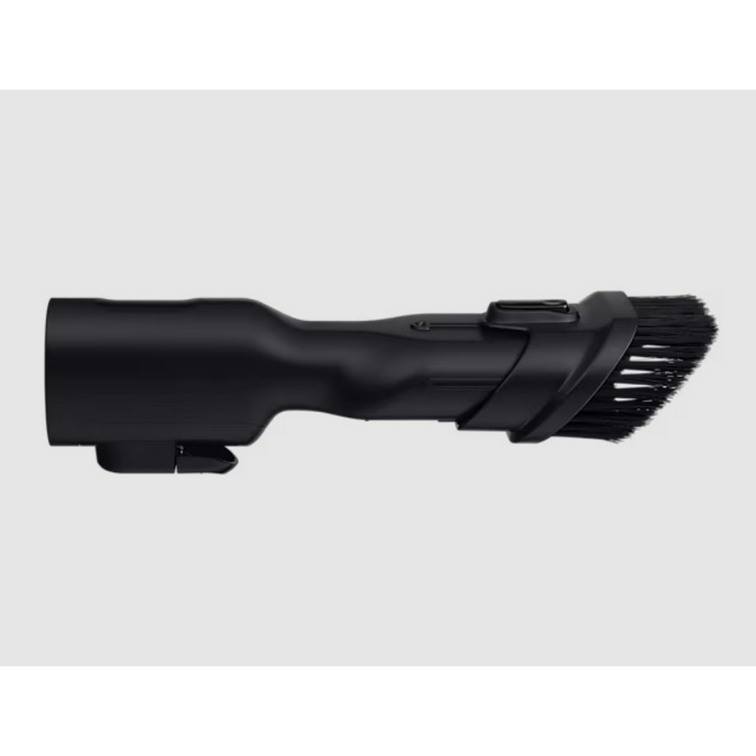 Black vacuum cleaner brush attachment. Angled view, isolated on a light gray background.