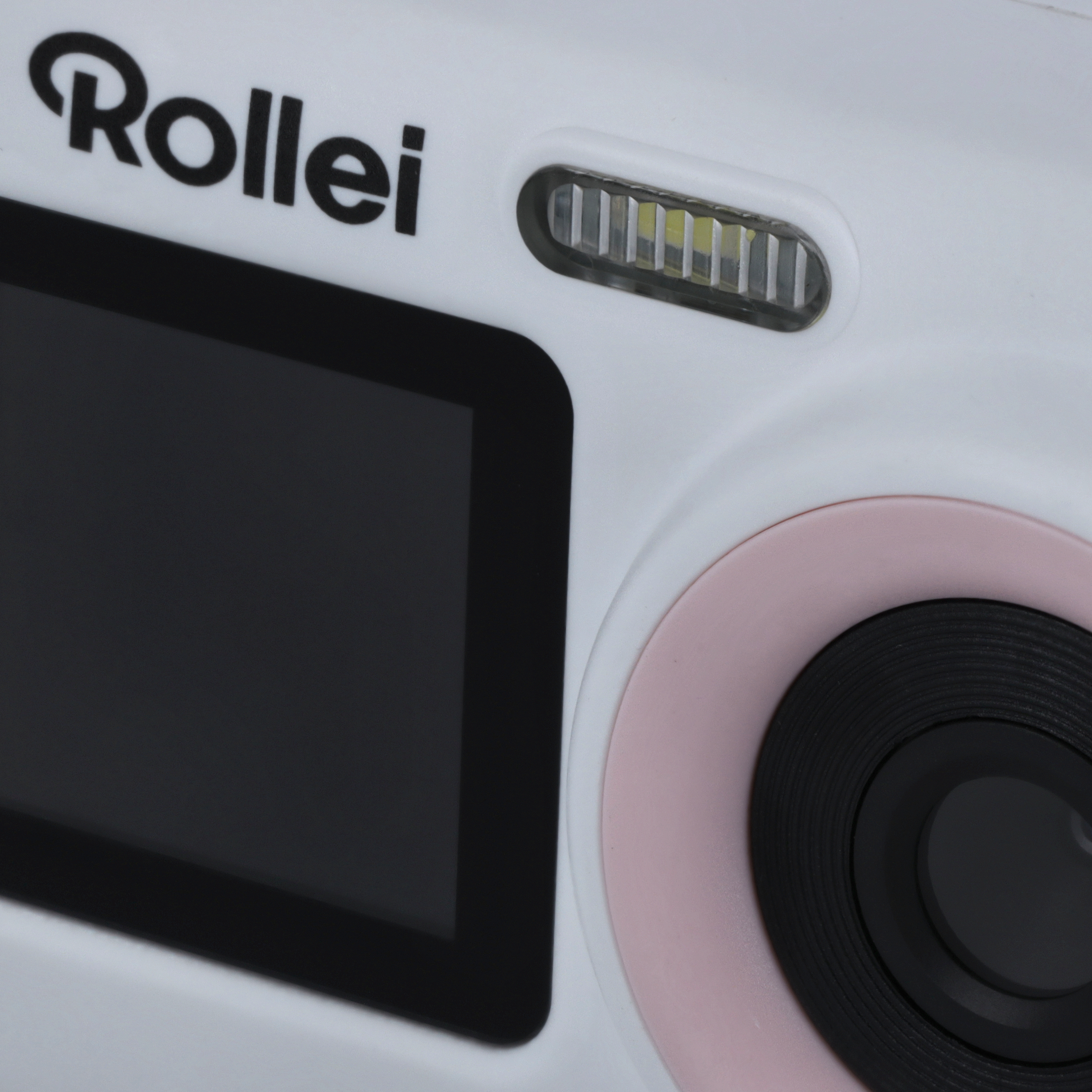 Eine weiße Digitalkamera mit schwarzem Bildschirm und rosa Details.