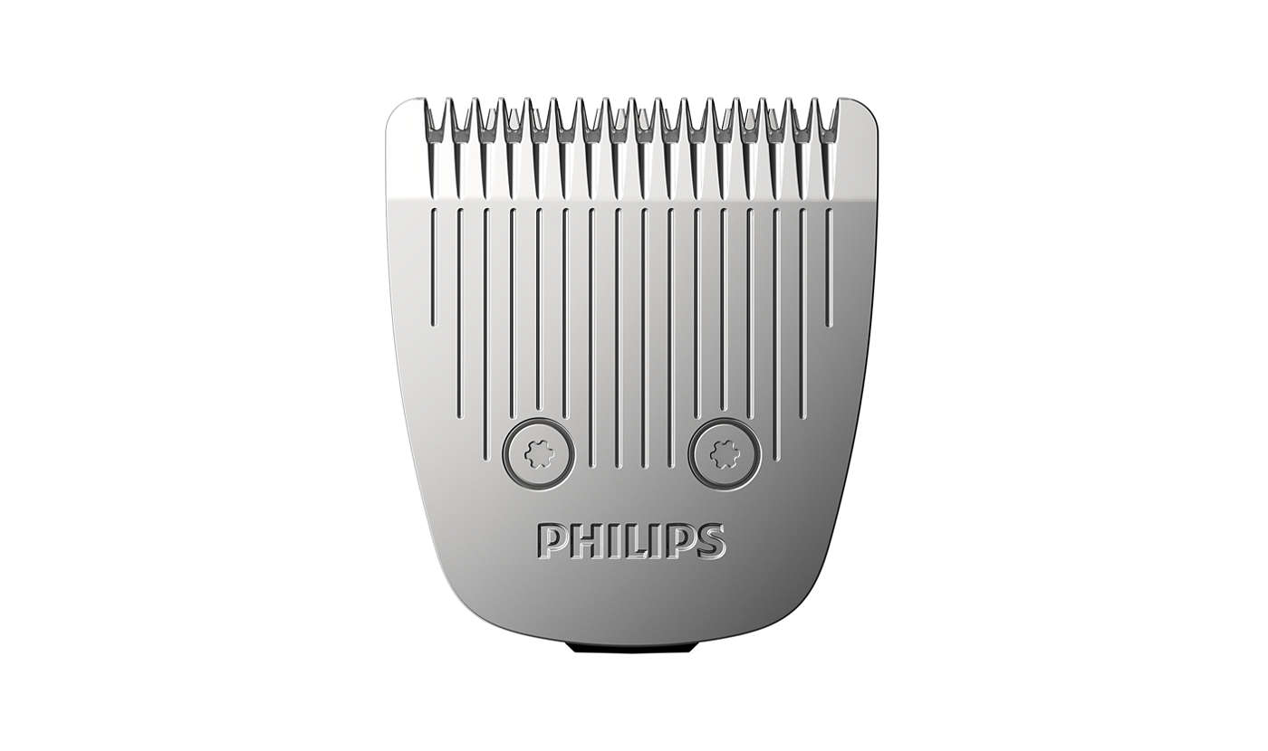 Közelkép egy Philips trimmelő pengéjéről. Ezüst, téglalap alakú, függőleges fogakkal és két csavarlyukkal.