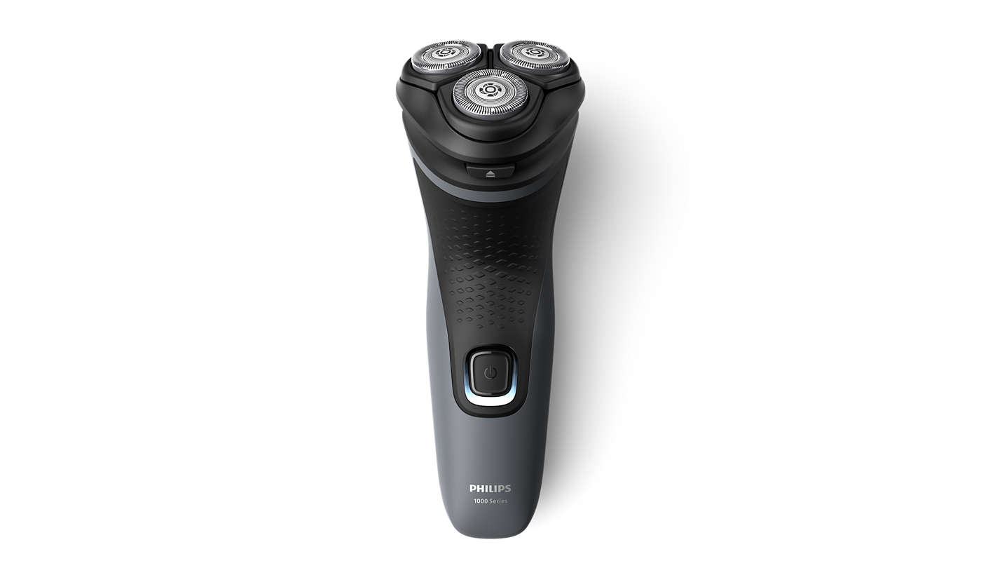 Philips elektromos borotva fehér háttéren. Három forgófeje és egy szürke nyele van.