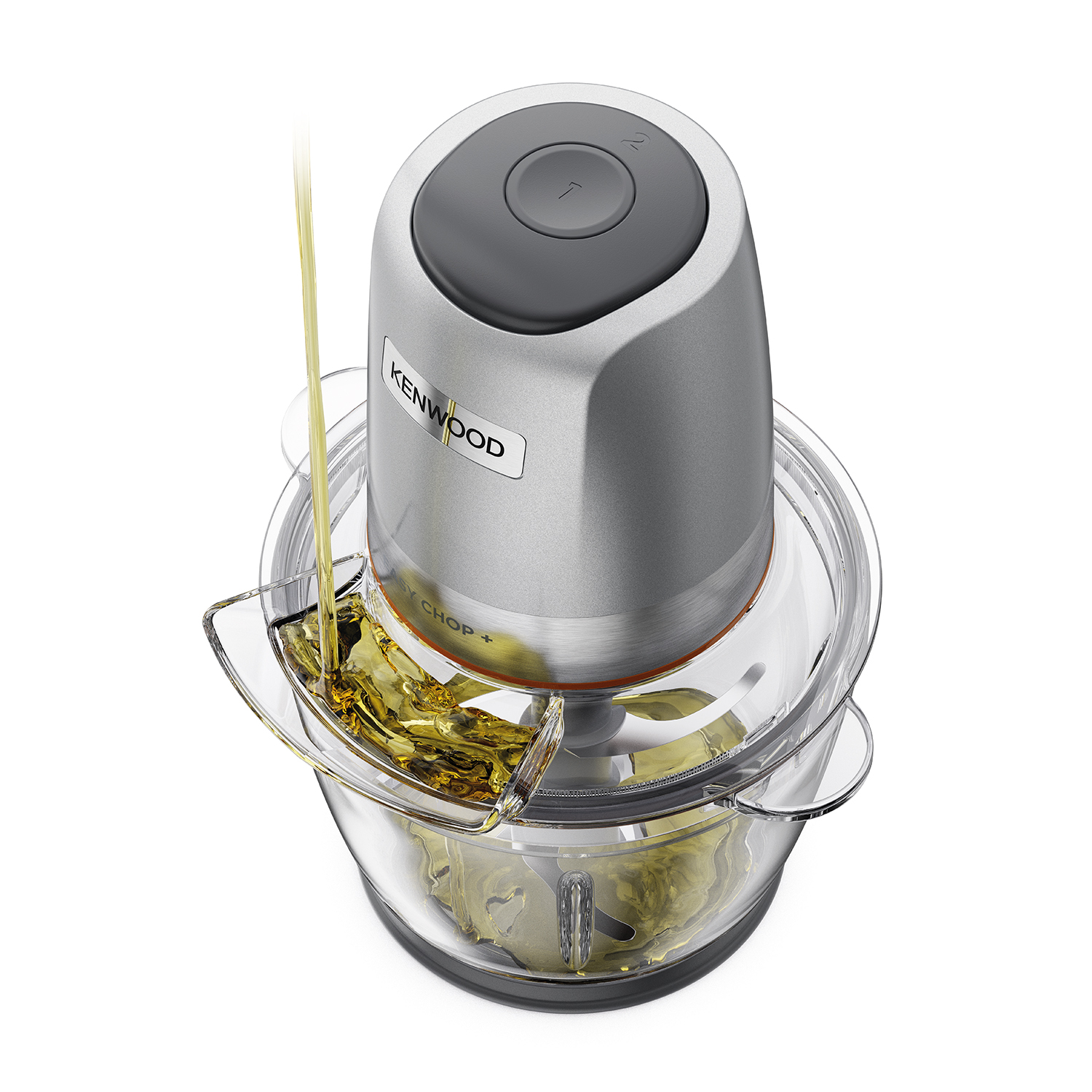 Robot da cucina Kenwood con olio versato nella ciotola, vista dall'alto.