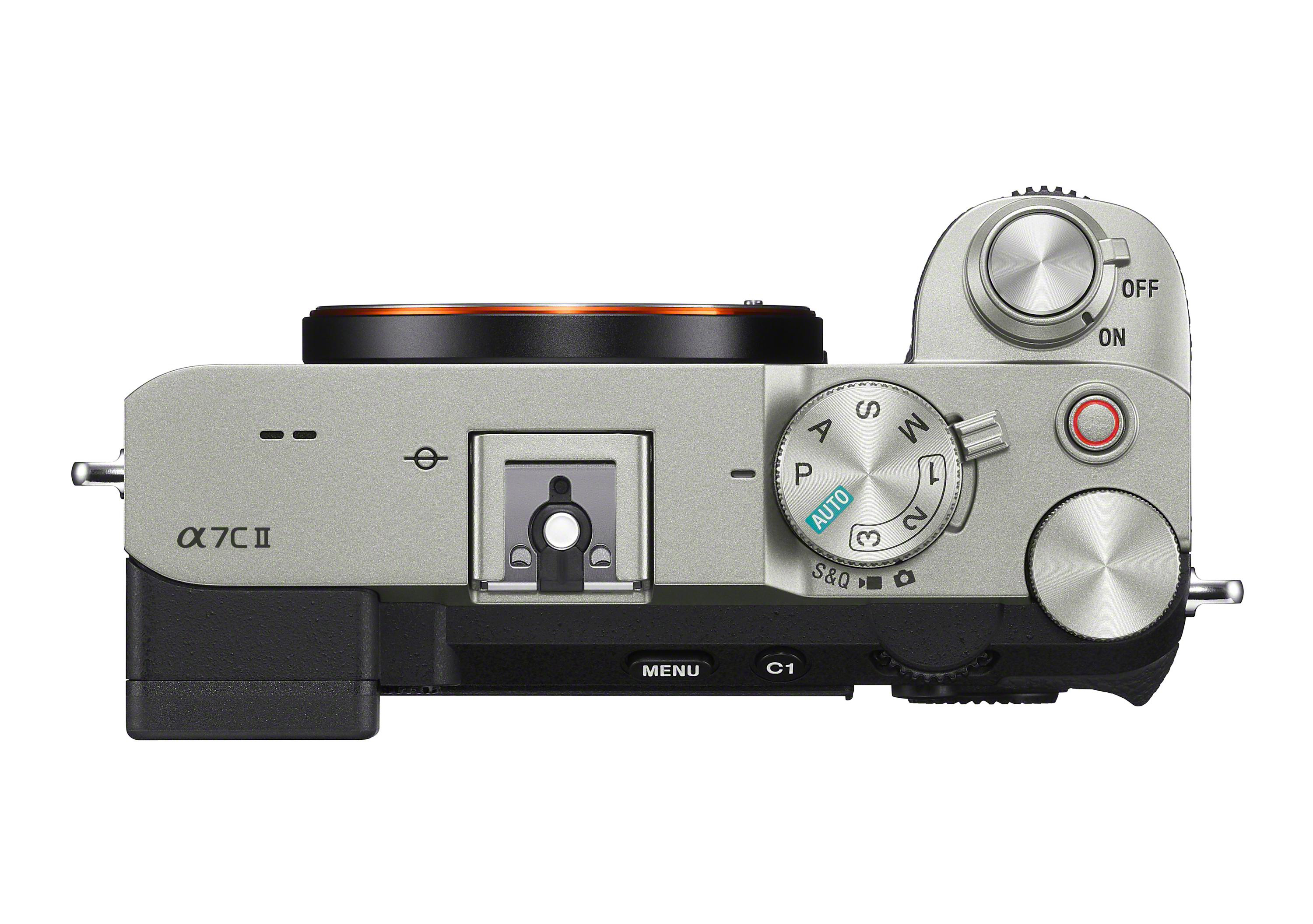 Draufsicht auf eine Sony-Kamera, silber und schwarz. Knöpfe und Wählscheiben sind sichtbar.