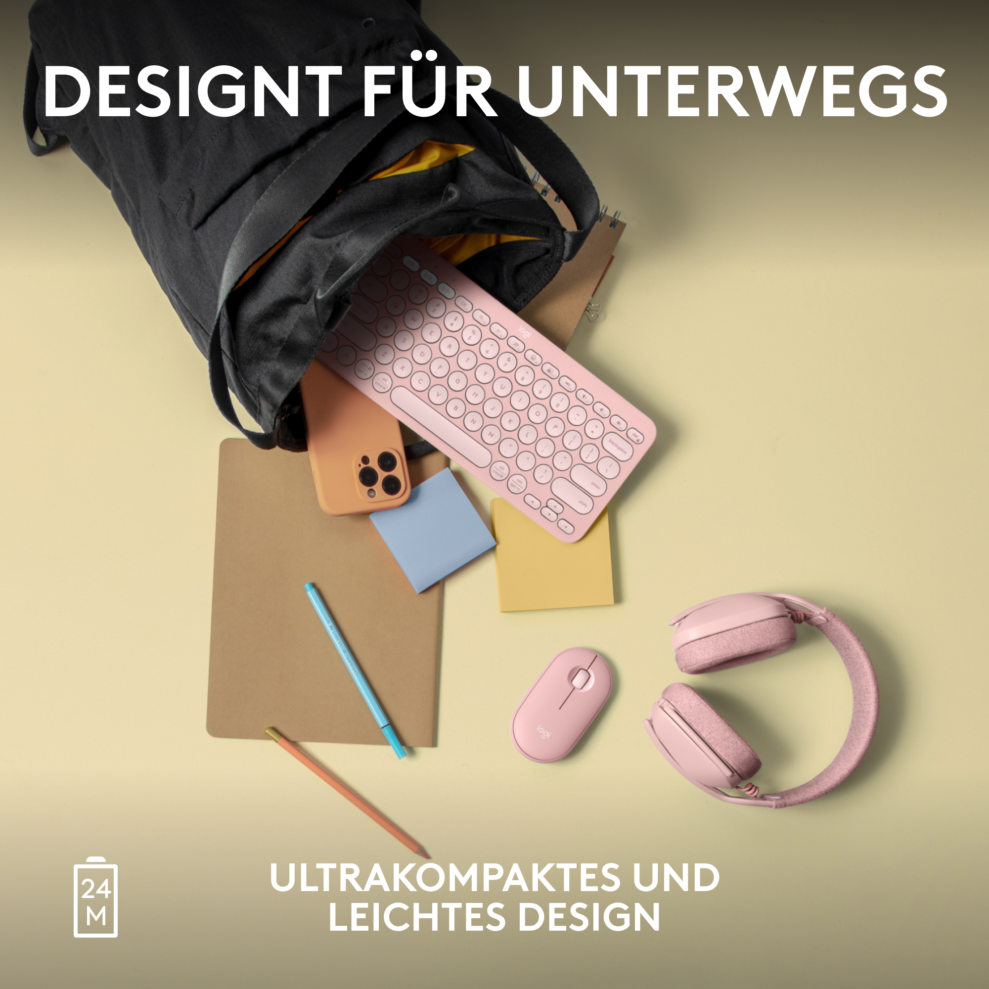 Rosa Tastatur, Telefon, Maus, Kopfhörer, Notizblock und Bleistift in einer schwarzen Tasche.