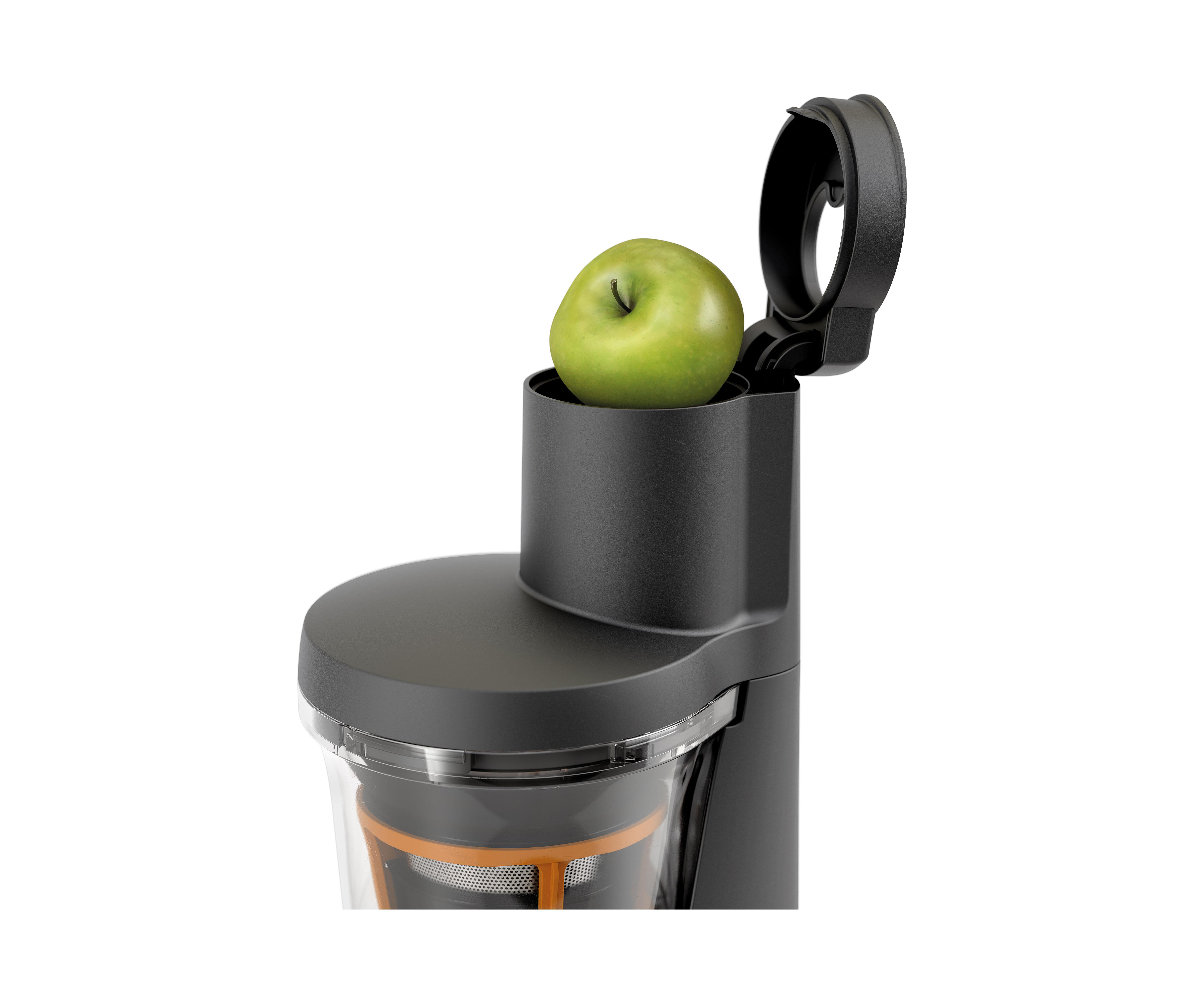 Ein schwarzer Entsafter, in den ein Apfel gelegt wird. Der Hintergrund ist weiß.