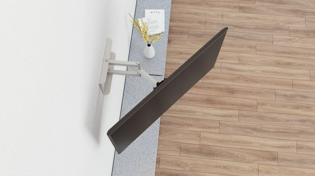 Moderner Fernseher an weißer Wand mit Holzboden. Links vom Bildschirm eine Vase mit Blumen.