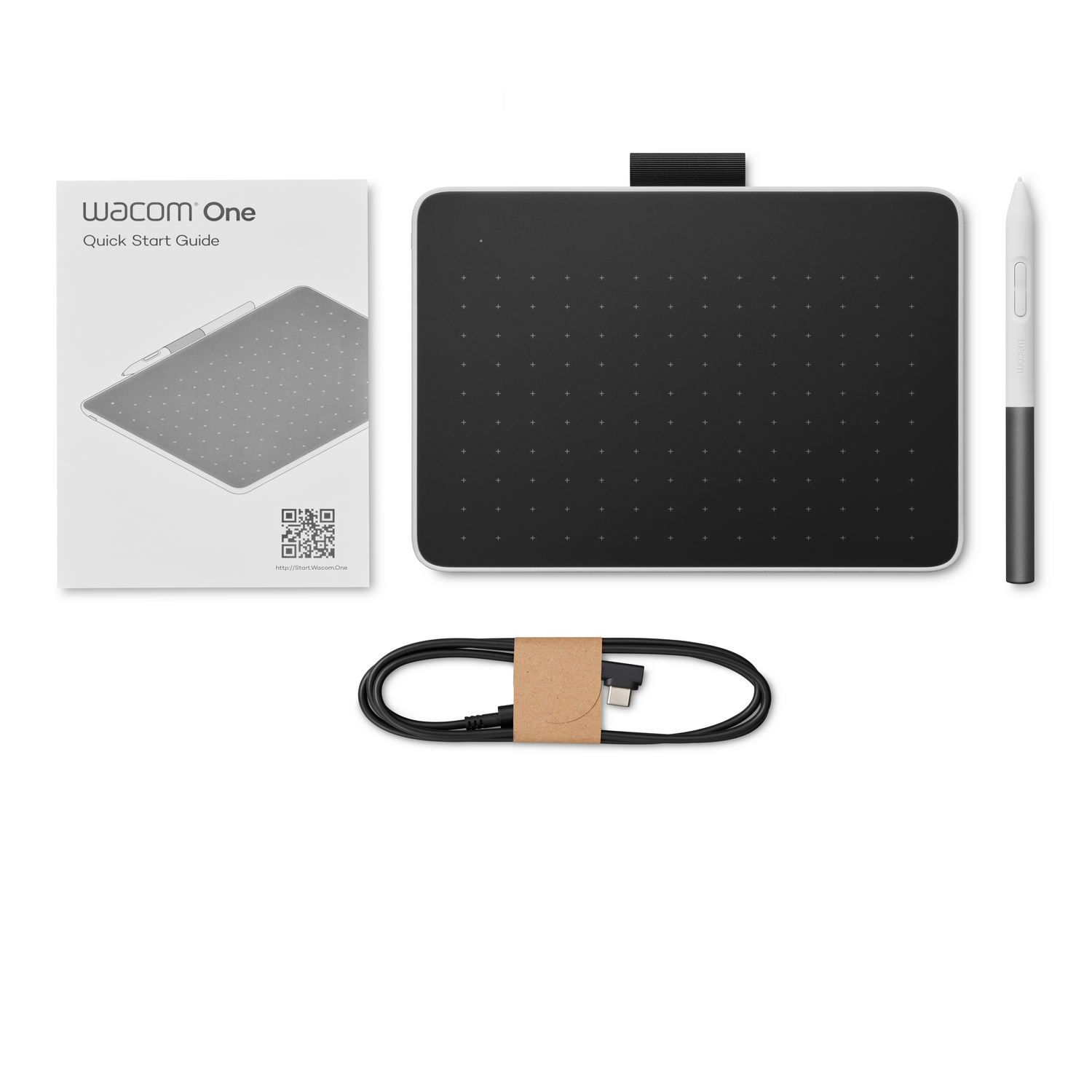 Wacom One tablet, pen, cable, and Quick Start Guide on white background.