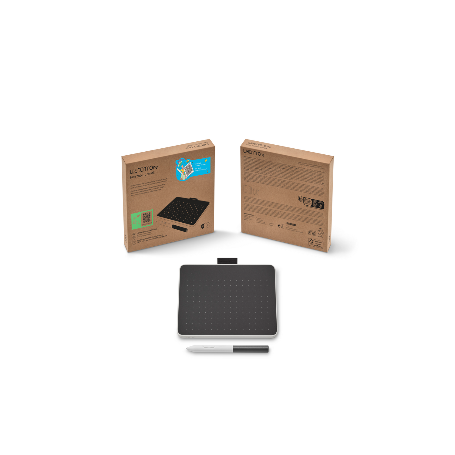 Wacom One drawing tablet, pen, and boxes, top view.