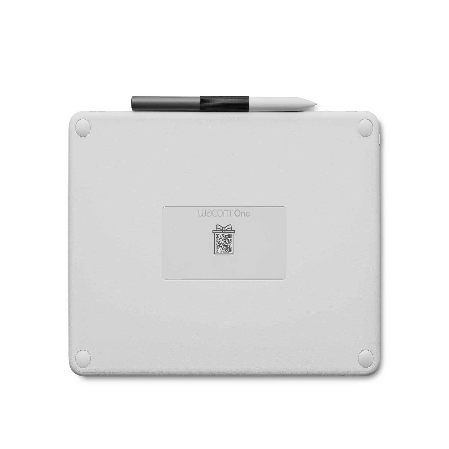 White Wacom One tablet with a stylus on top. The back shows the Wacom One logo.