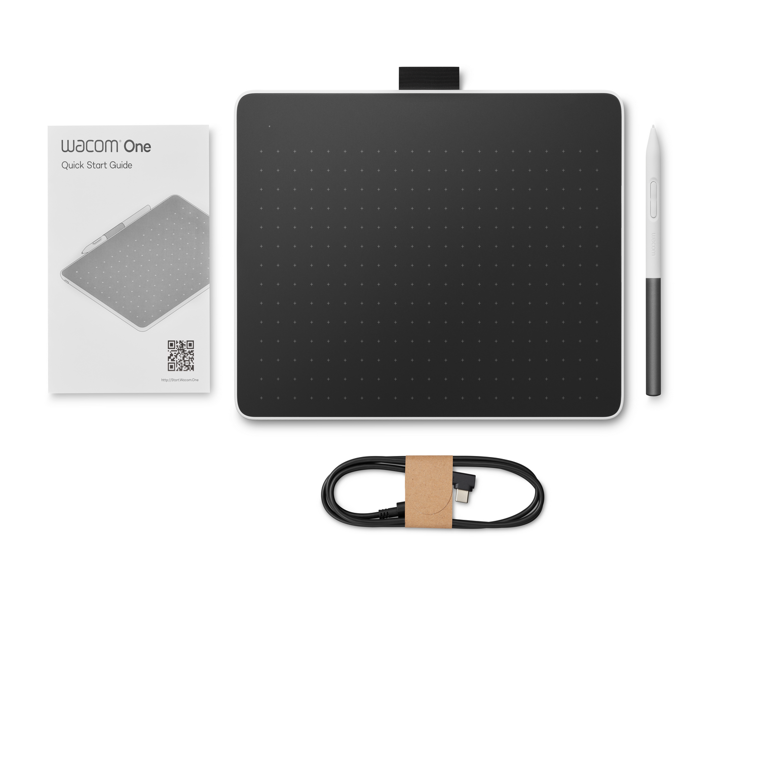 White drawing tablet with black surface, stylus, USB cable, and quick start guide.