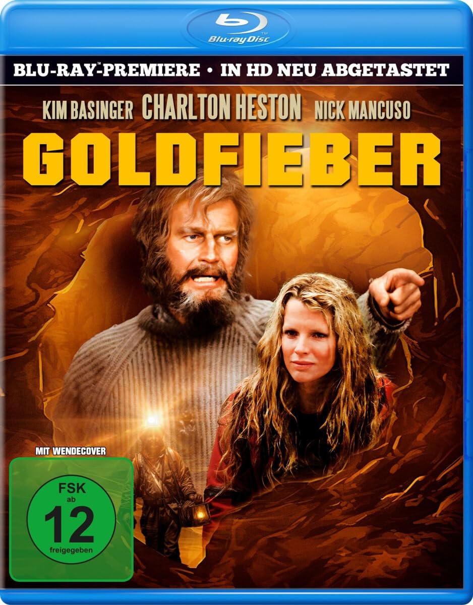 Filmcover mit Kim Basinger und Charlton Heston in einer Höhle, mit einem grünen Bewertungssiegel.