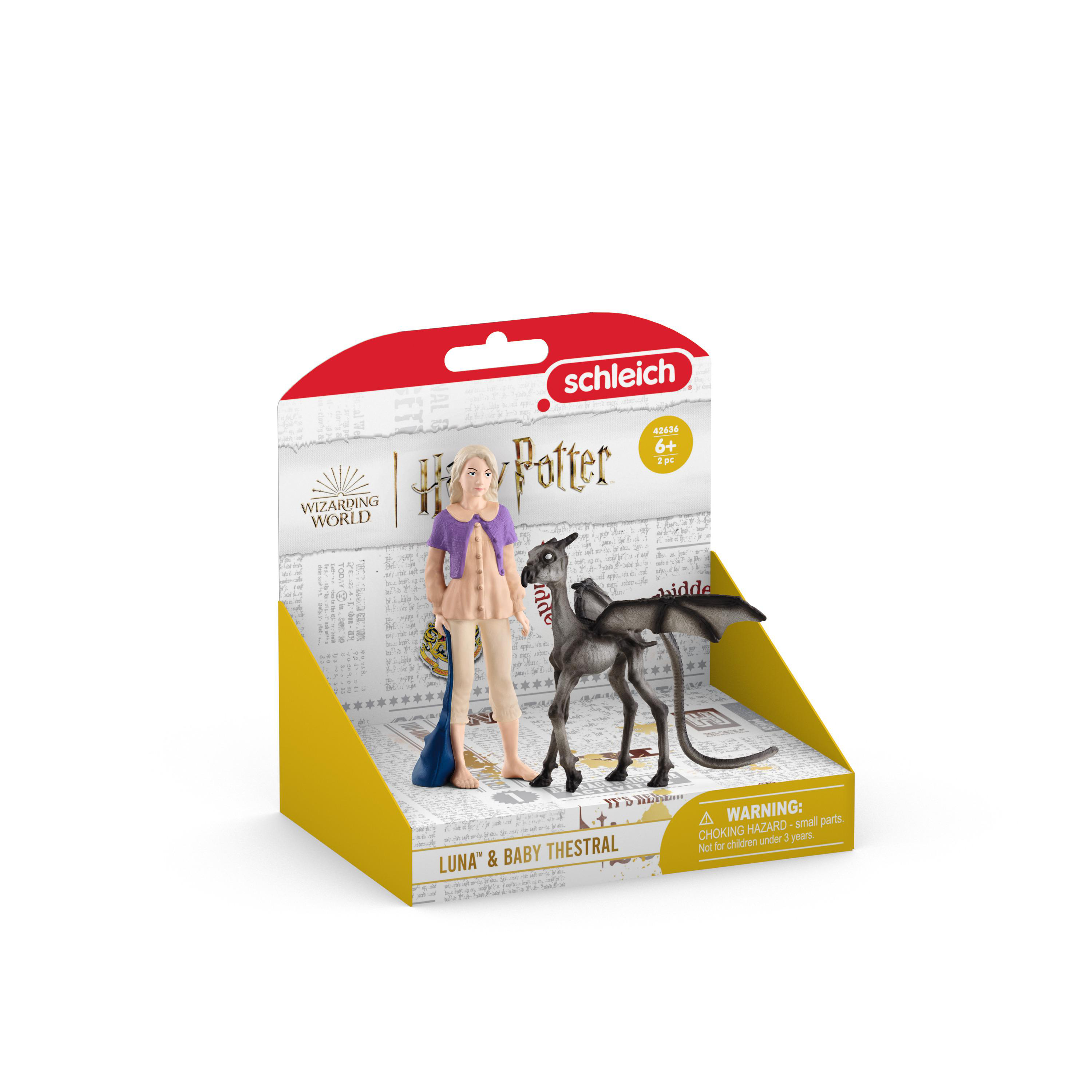 Ein Spielzeugset mit einer Mädchenfigur und einem schwarzen, geflügelten Pferd auf Box.