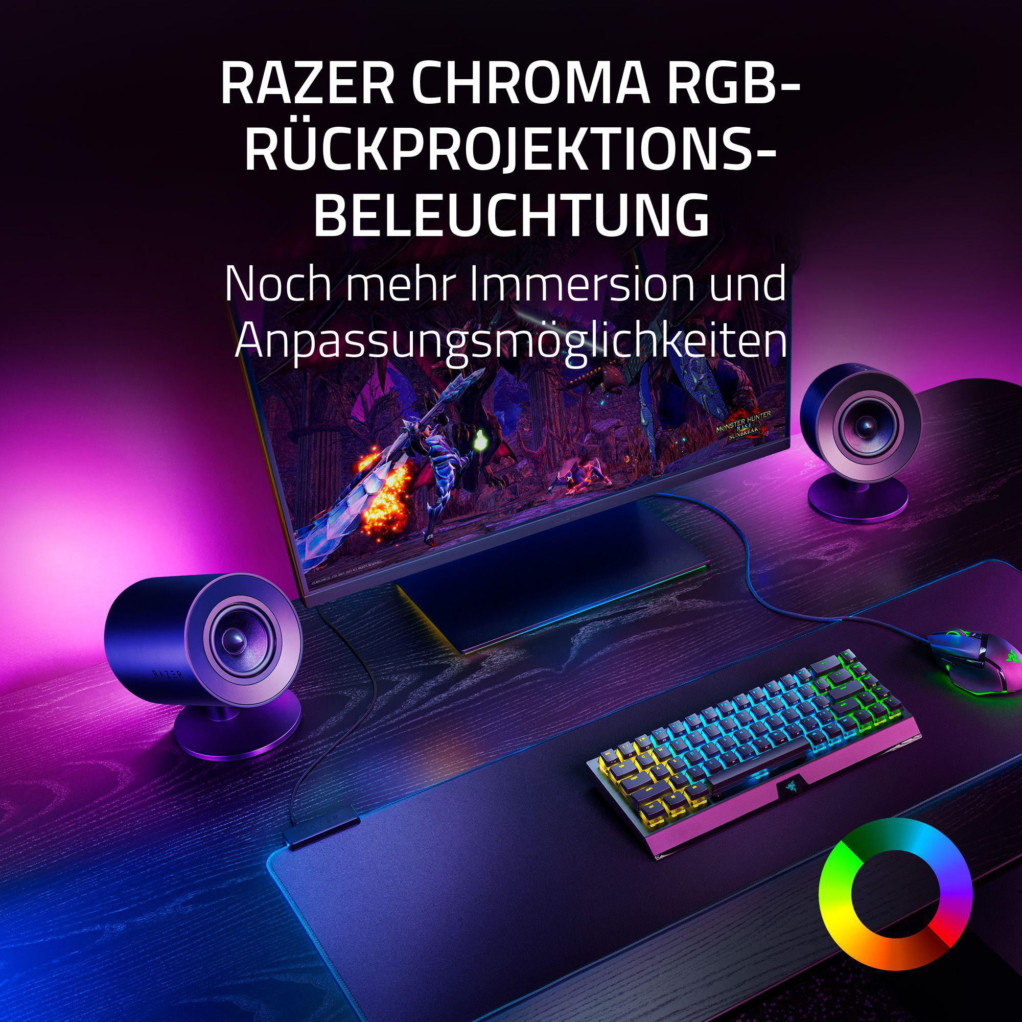 Schreibtisch-Setup mit Razer-Peripheriegeräten, Bildschirm, Lautsprechern und RGB-Beleuchtung.