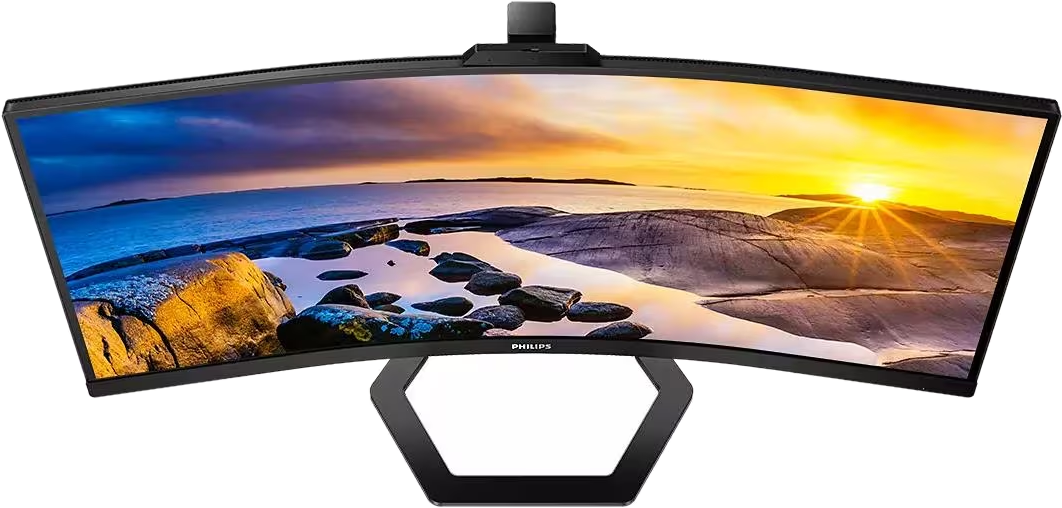 Moniteur ultra large avec écran incurvé. L'écran affiche un coucher de soleil sur l'océan.