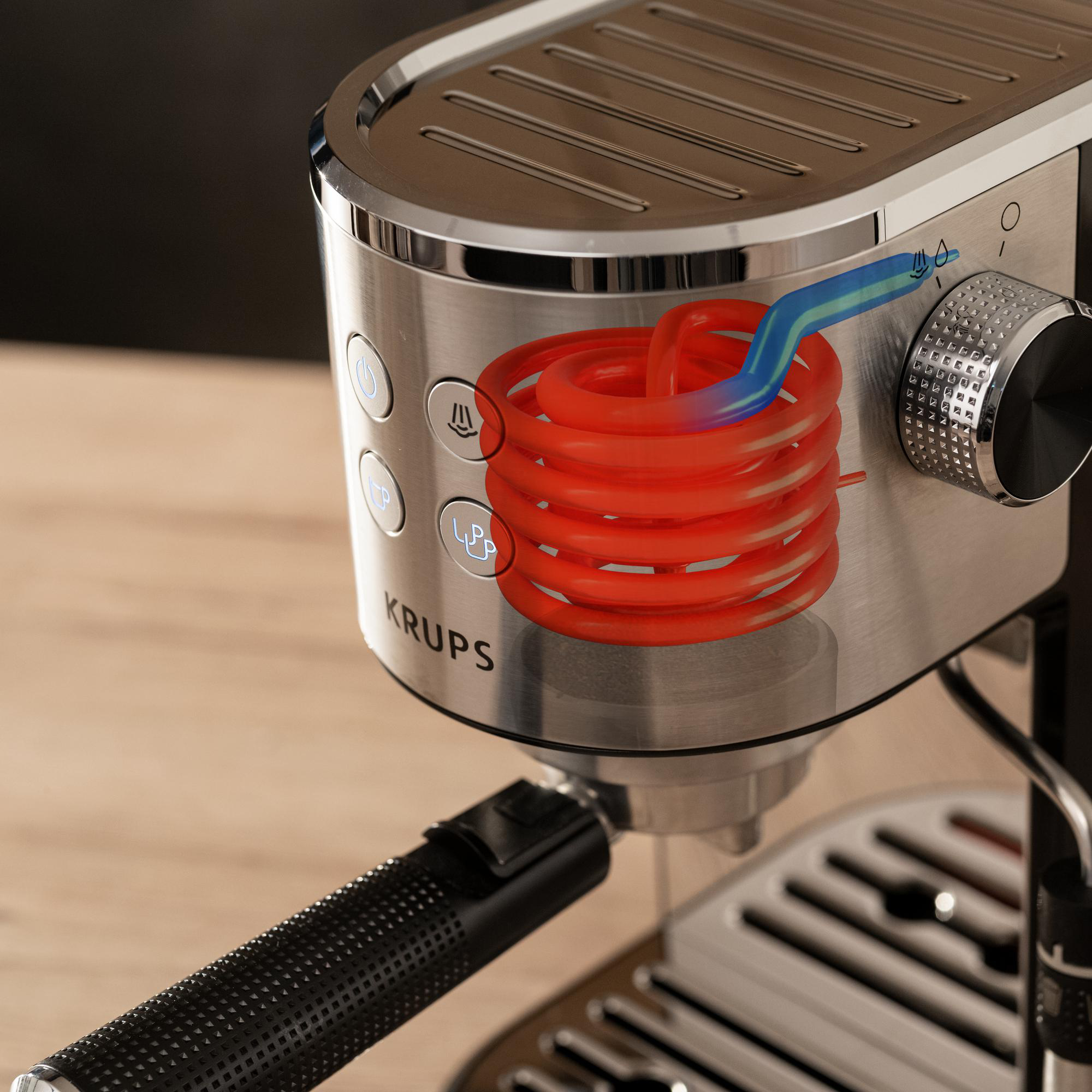 Espressomaschine mit rotem Spulendetail. Silber- und Schwarztöne. Nahaufnahme.