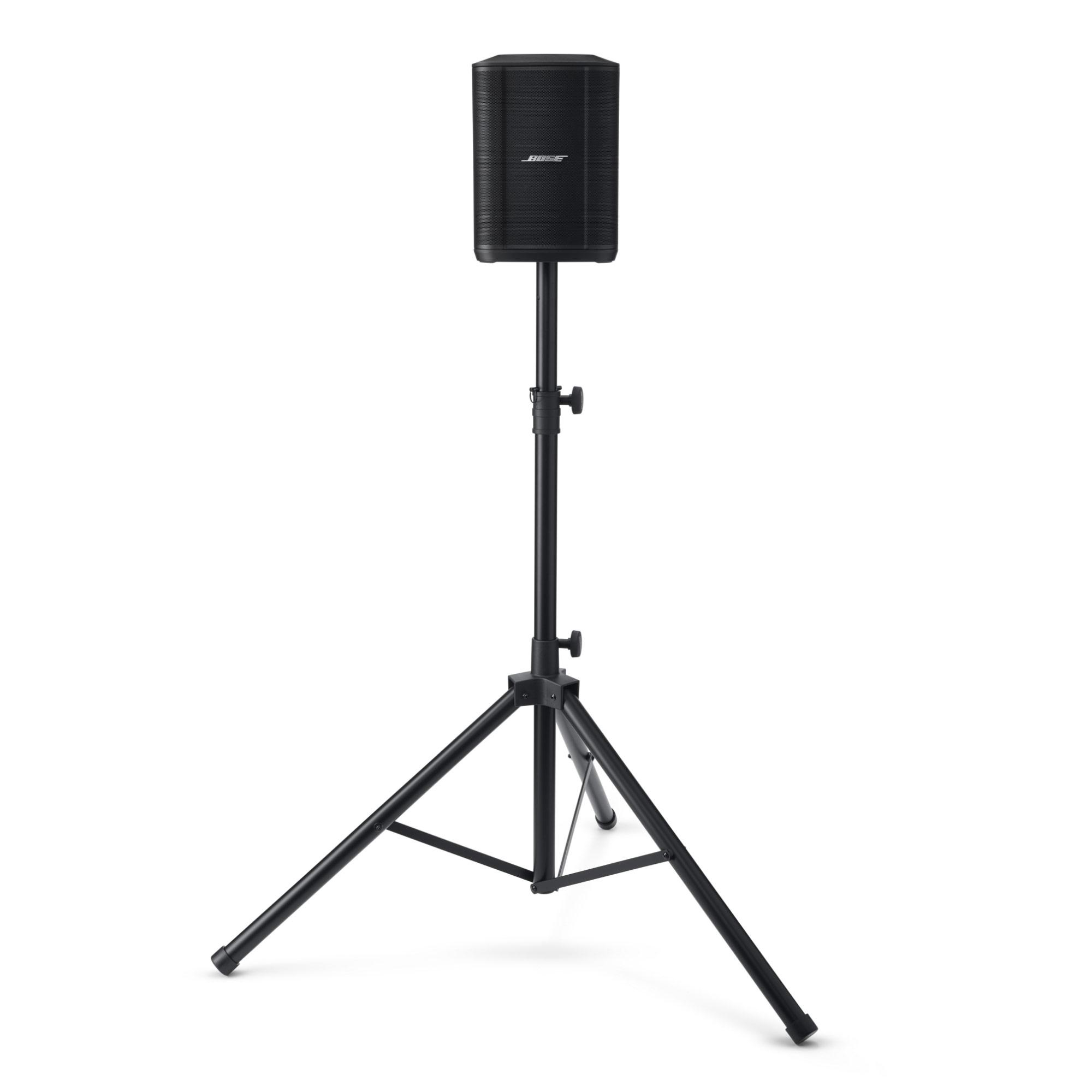 Schwarzer Lautsprecher auf schwarzem Ständer. Weißer Hintergrund.