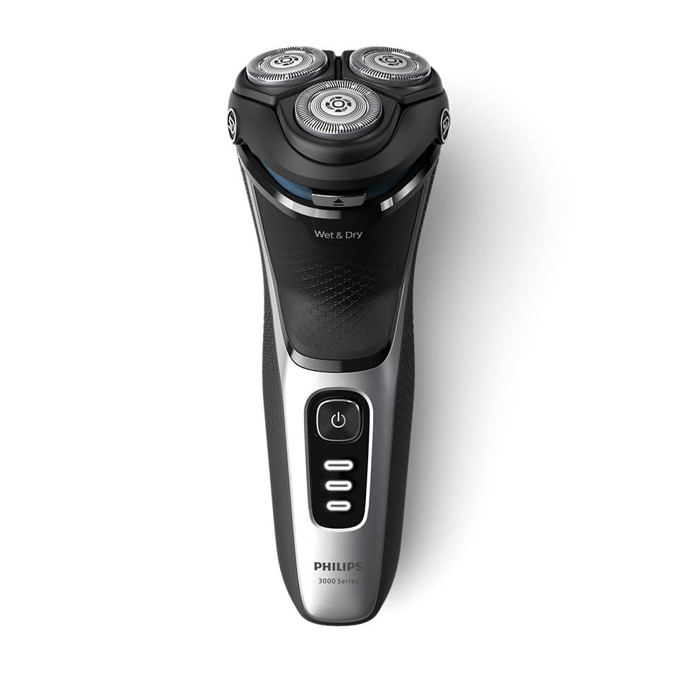 Ein schwarzer und silberner Philips Wet & Dry Rasierer mit 3 Rotationsköpfen und einem Einschaltknopf.