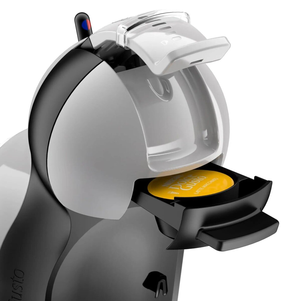 Biało-czarny ekspres do kawy Dolce Gusto z żółtą kapsułką kawy w środku.