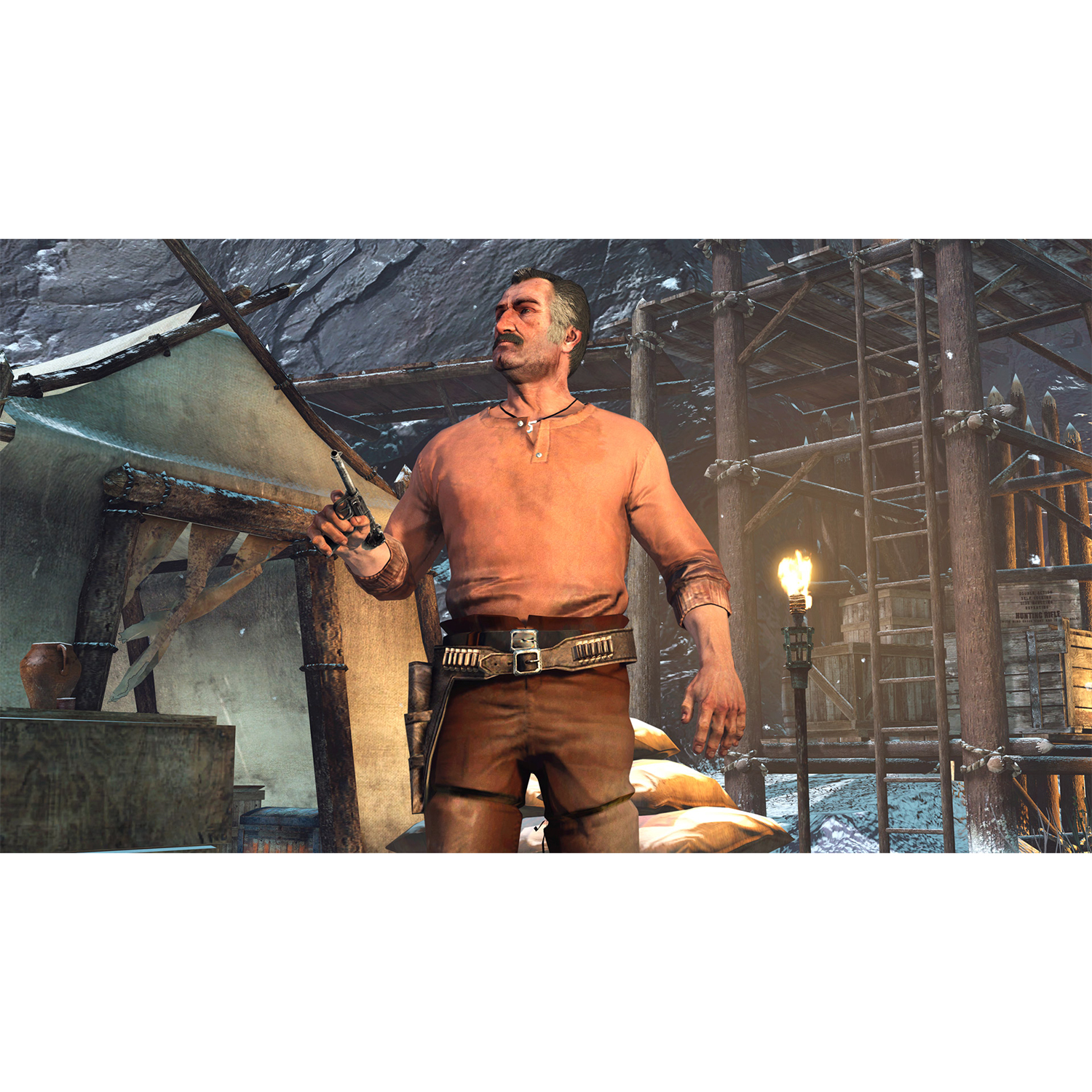 Un uomo in abito western che tiene una pistola in un ambiente innevato.