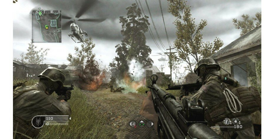 Scena z gry wideo. Żołnierze na polu, eksplozje i helikopter na niebie.