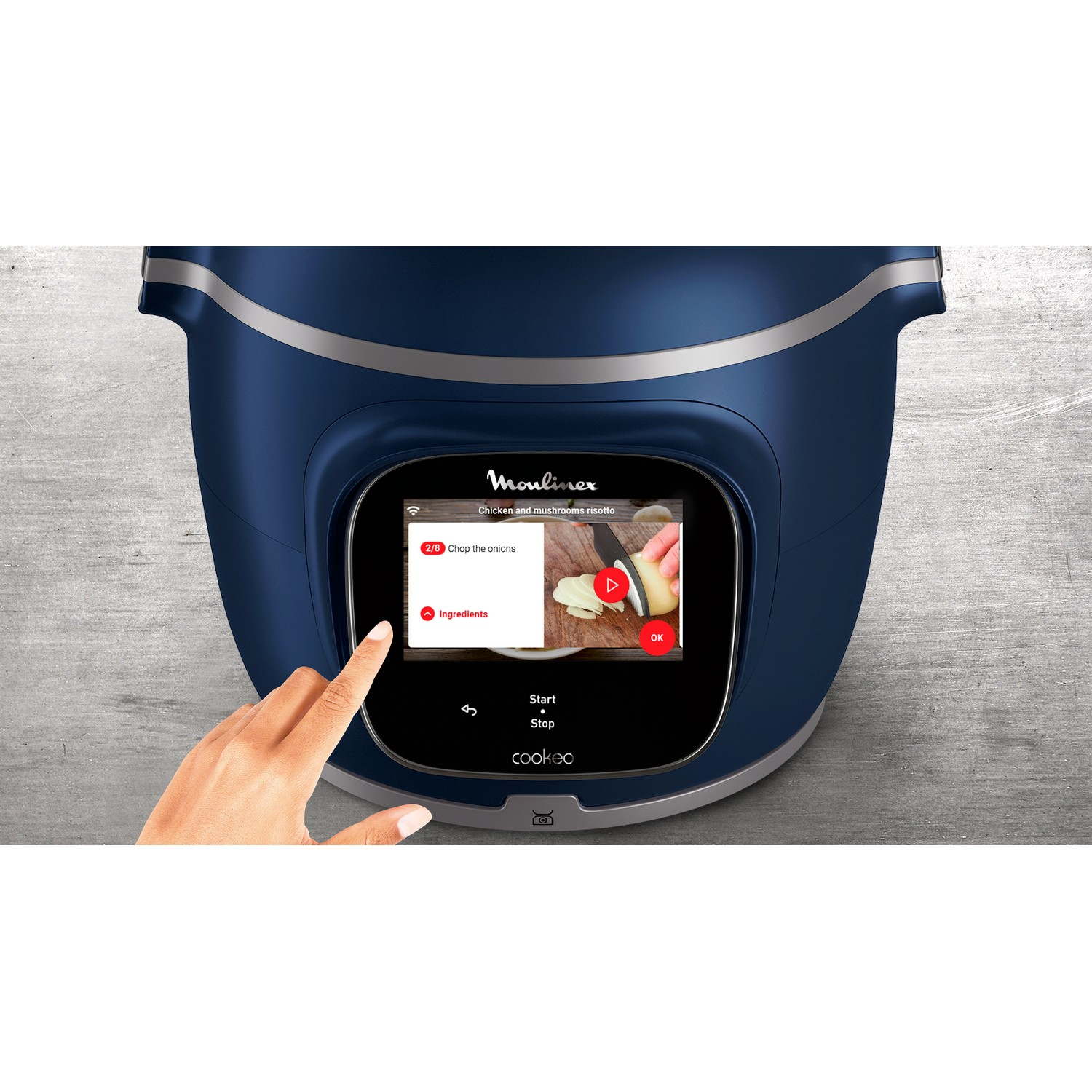 Blue cooking machine with a touchscreen, hand touching the screen.