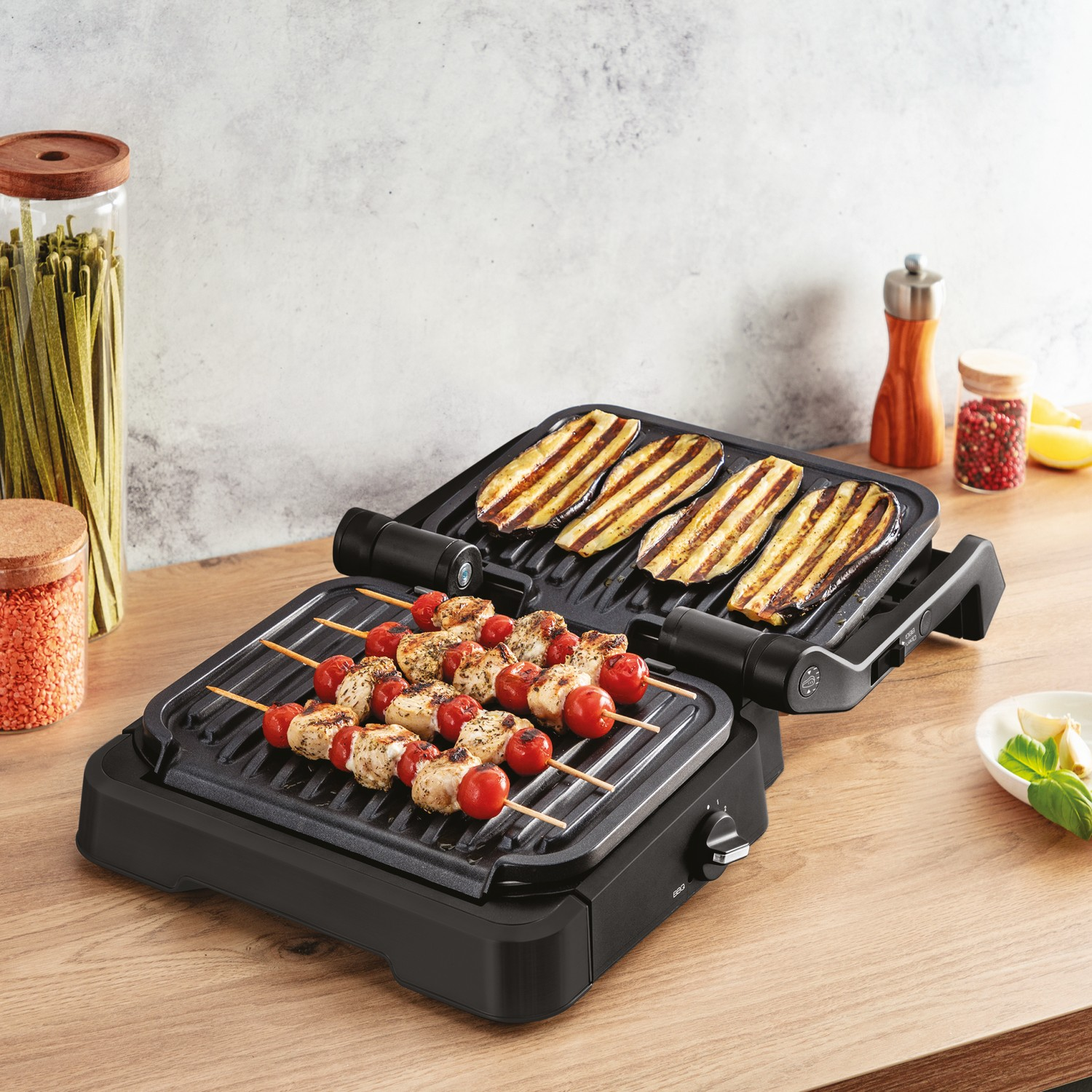 Grill with food. Skewers, grilled vegetables, on wooden surface.