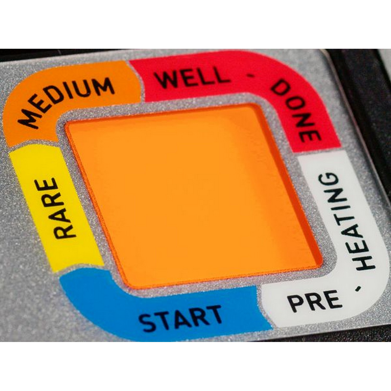 Close-up of a heating indicator with words like 'rare' and 'well-done'.