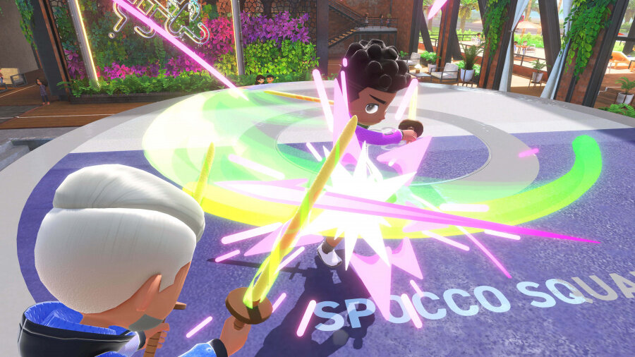 Dwie postacie z kreskówek walczące mieczami. Otaczają je kolorowe efekty energetyczne.