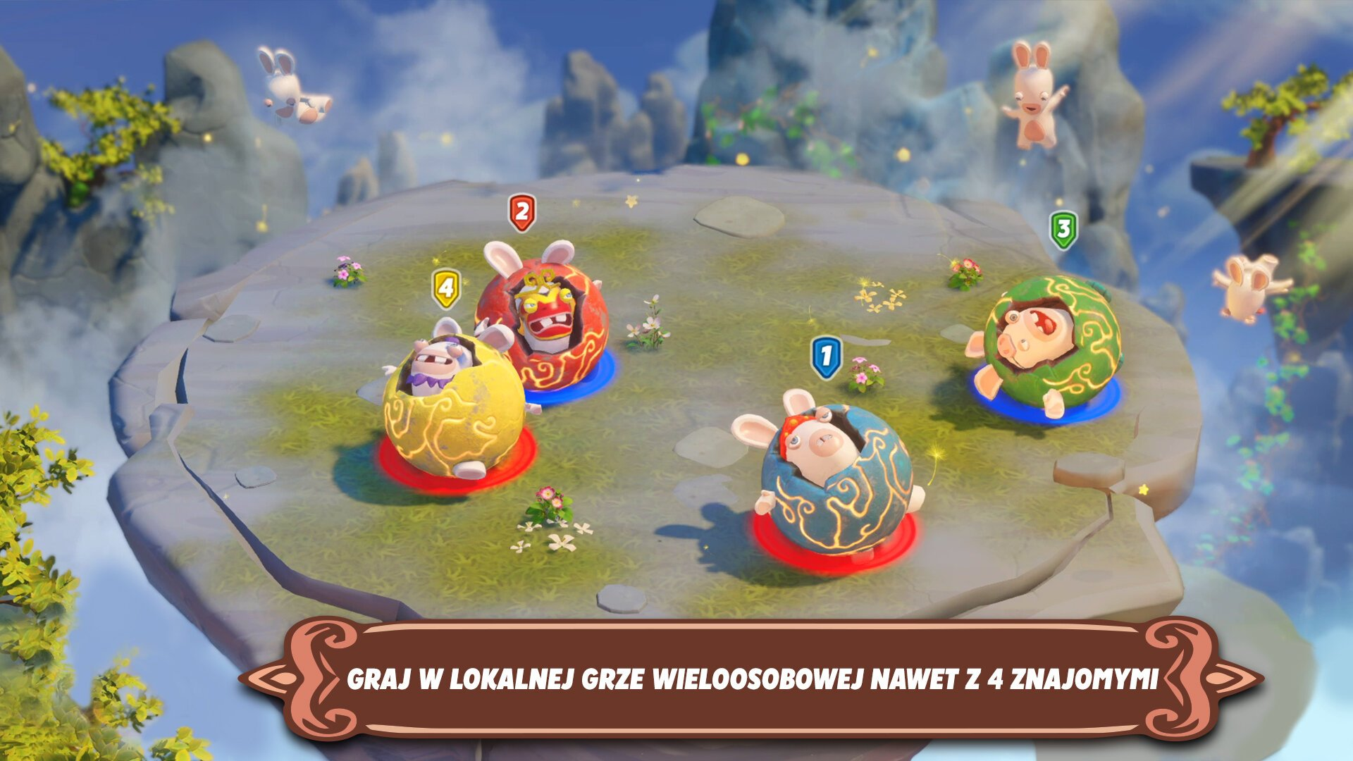 Scena gry z czterema Rabbids w ozdobnych skorupkach jaj na pływającej wyspie. Rabbids są ponumerowane 1-4. Latające Rabbids w tle.